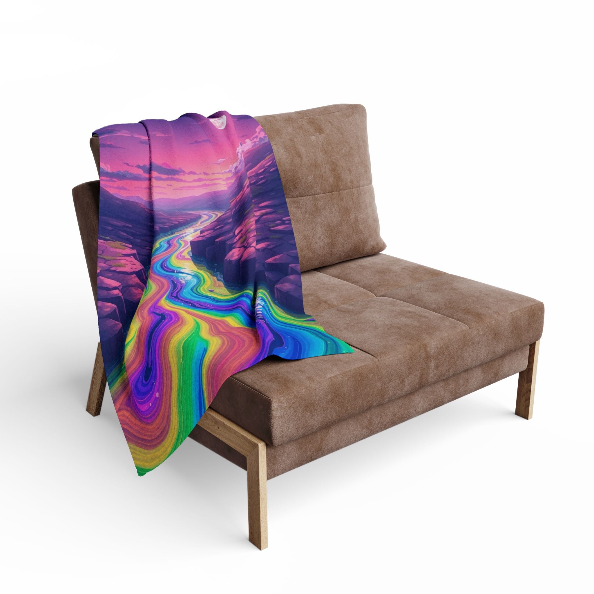 Multi coloured abstract landscape blanket draped over a brown sofa on a white background.