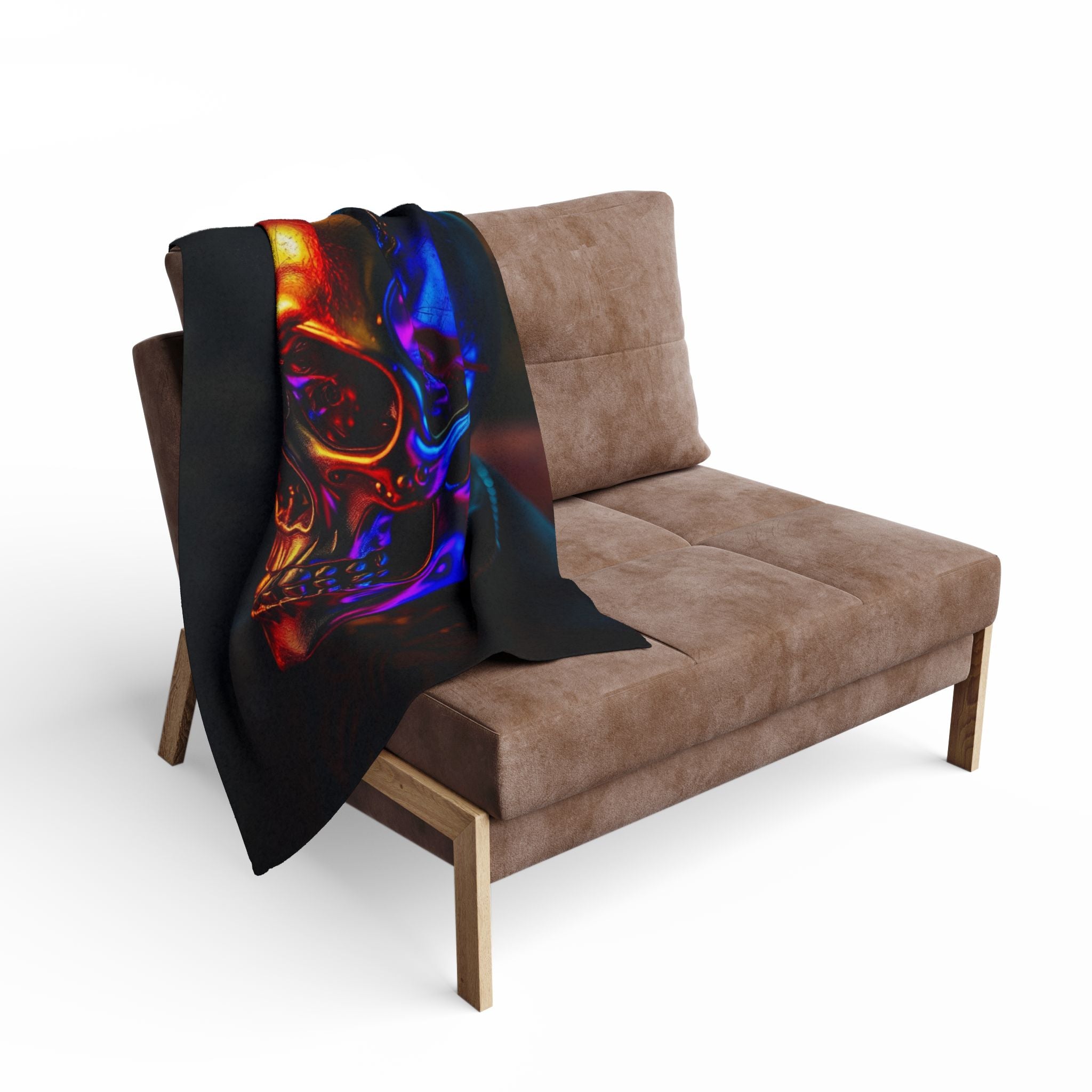 Golden skull design blanket draped over a brown sofa on a white background.