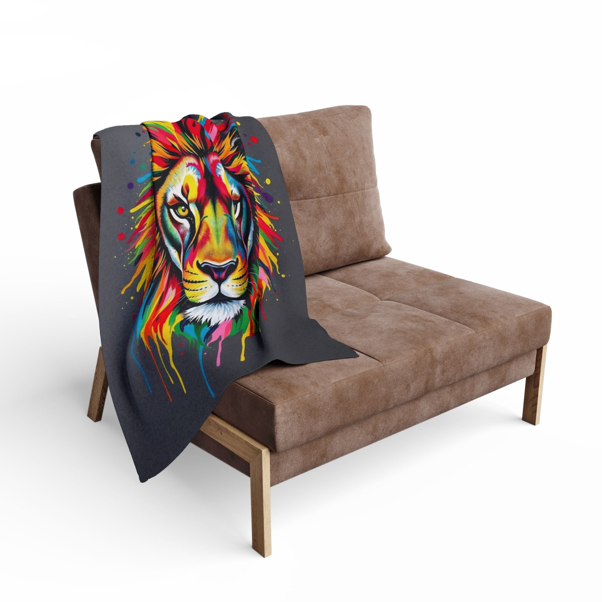 Multicoloured lion blanket draped over a brown sofa on a white background.