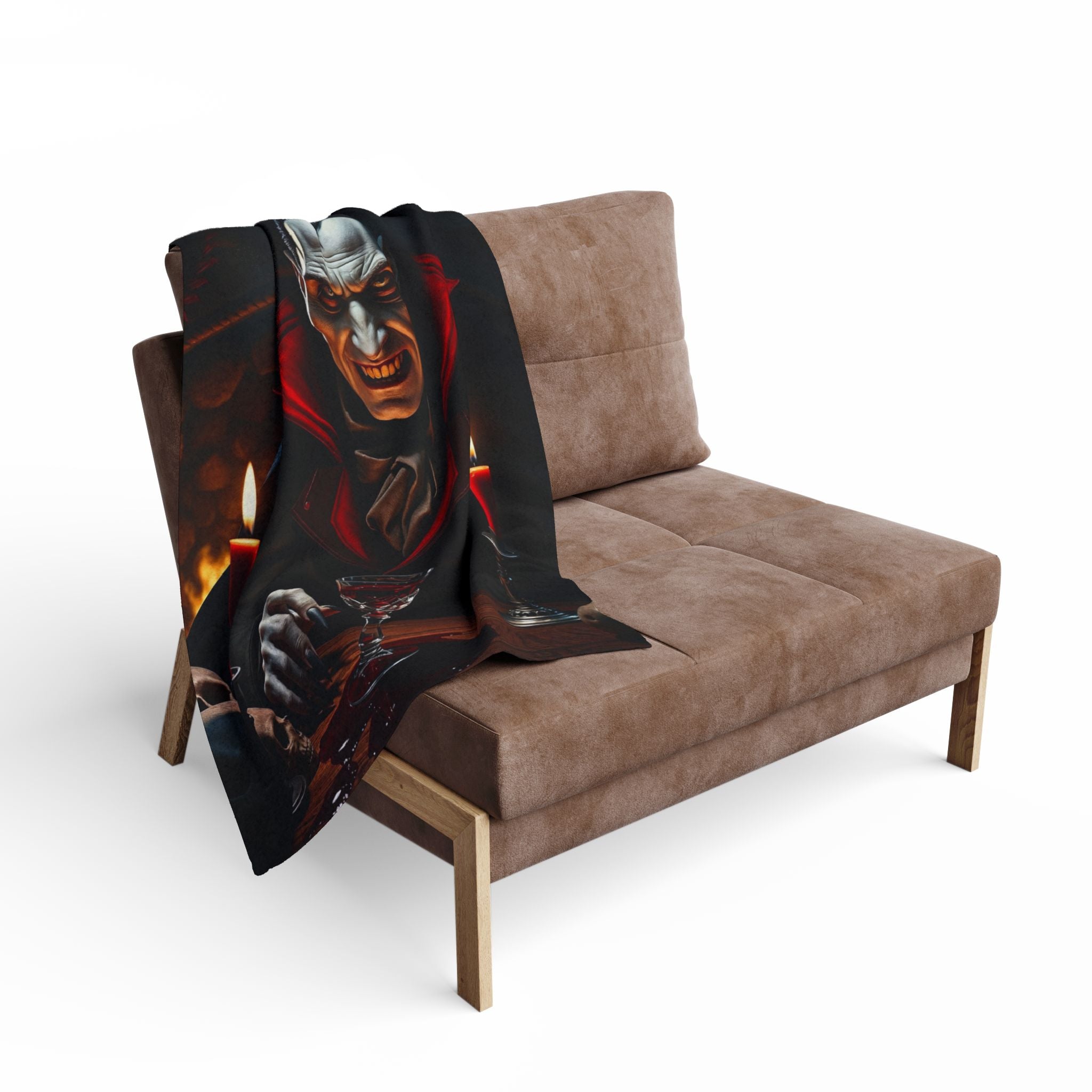 Decorative fleece blanket of dracula draped over a brown sofa on a white background.