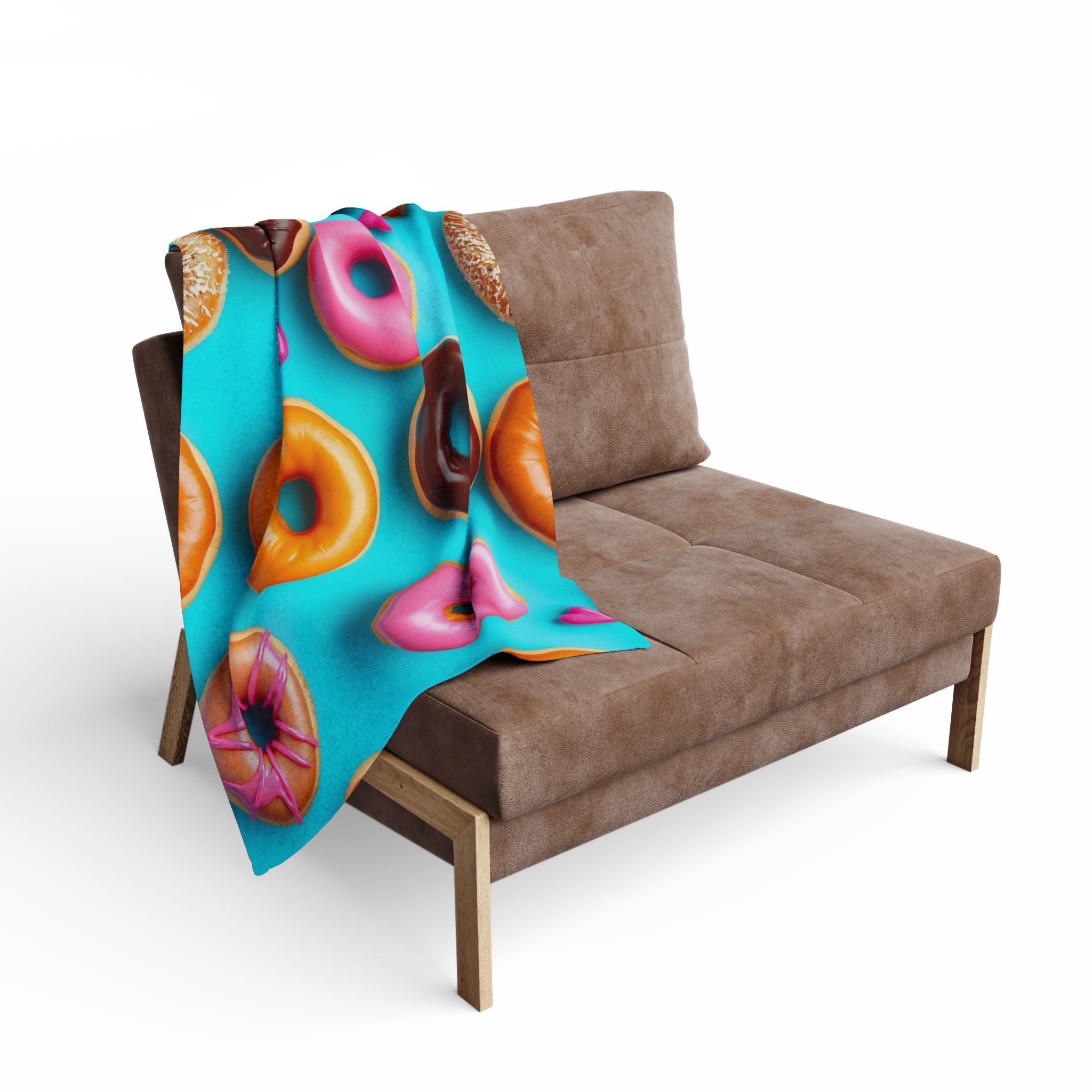 Colourful doughnut-patterned blanket draped over a brown sofa on a white background.