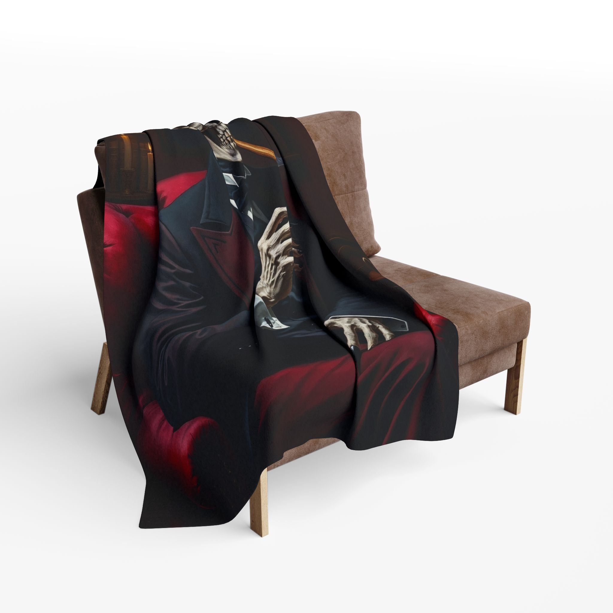 Decorative blanket with a skeleton smoking a cigar design draped over a brown chair on a white background.