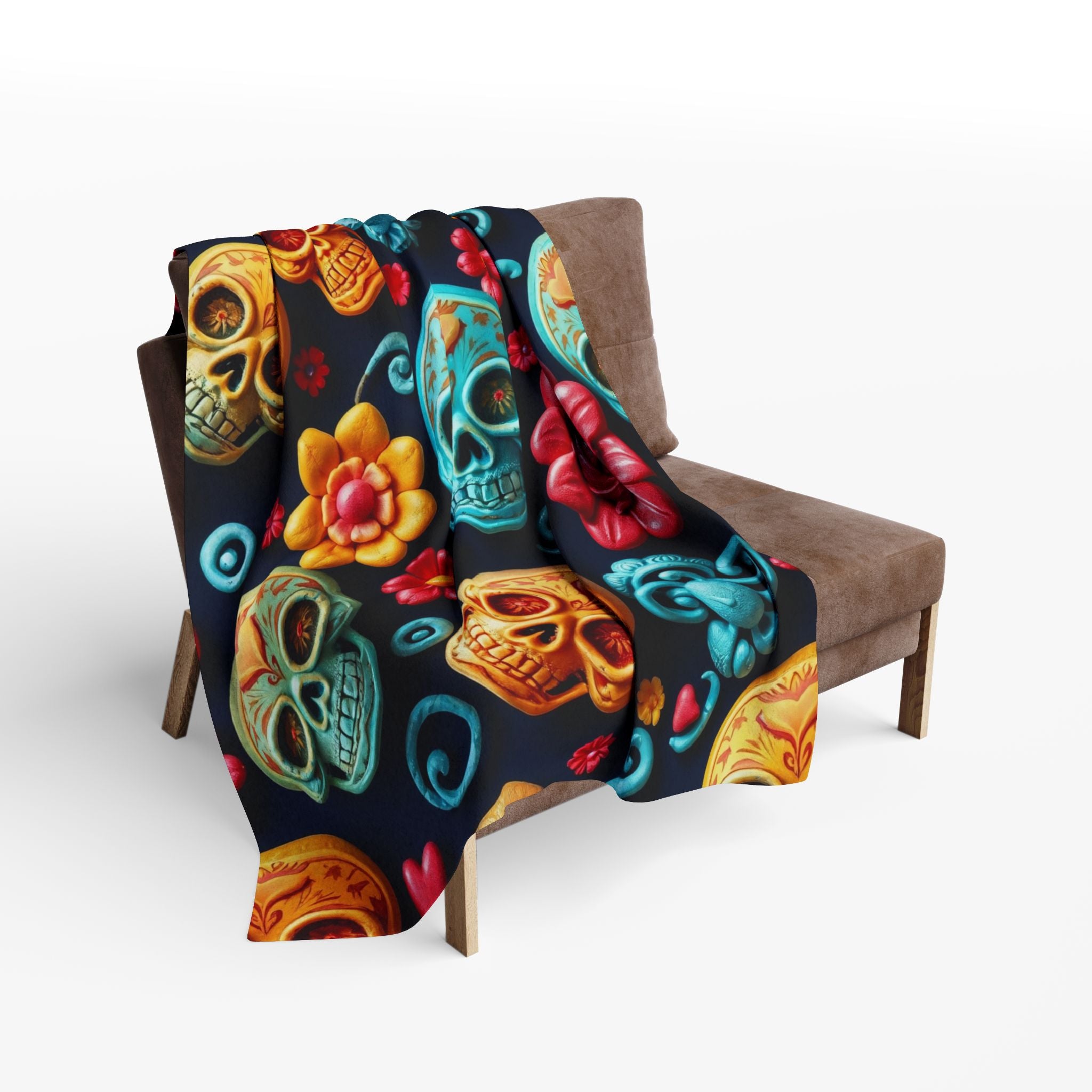 Colorful mexico day of the dead sugar skull patterned blanket draped over a brown chair on a white background.
