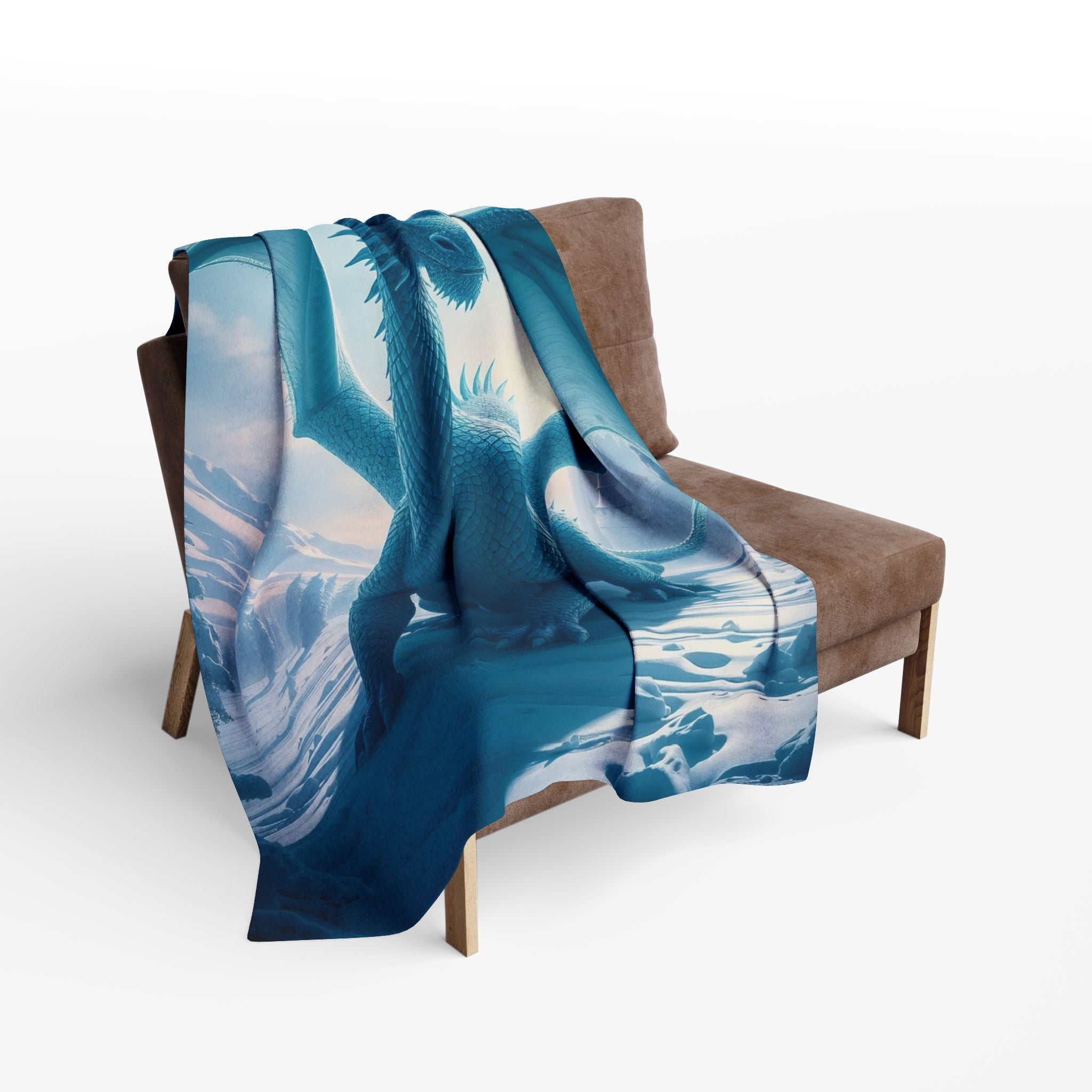 Blue and white ice dragon patterned blanket draped over a brown chair on a white background.
