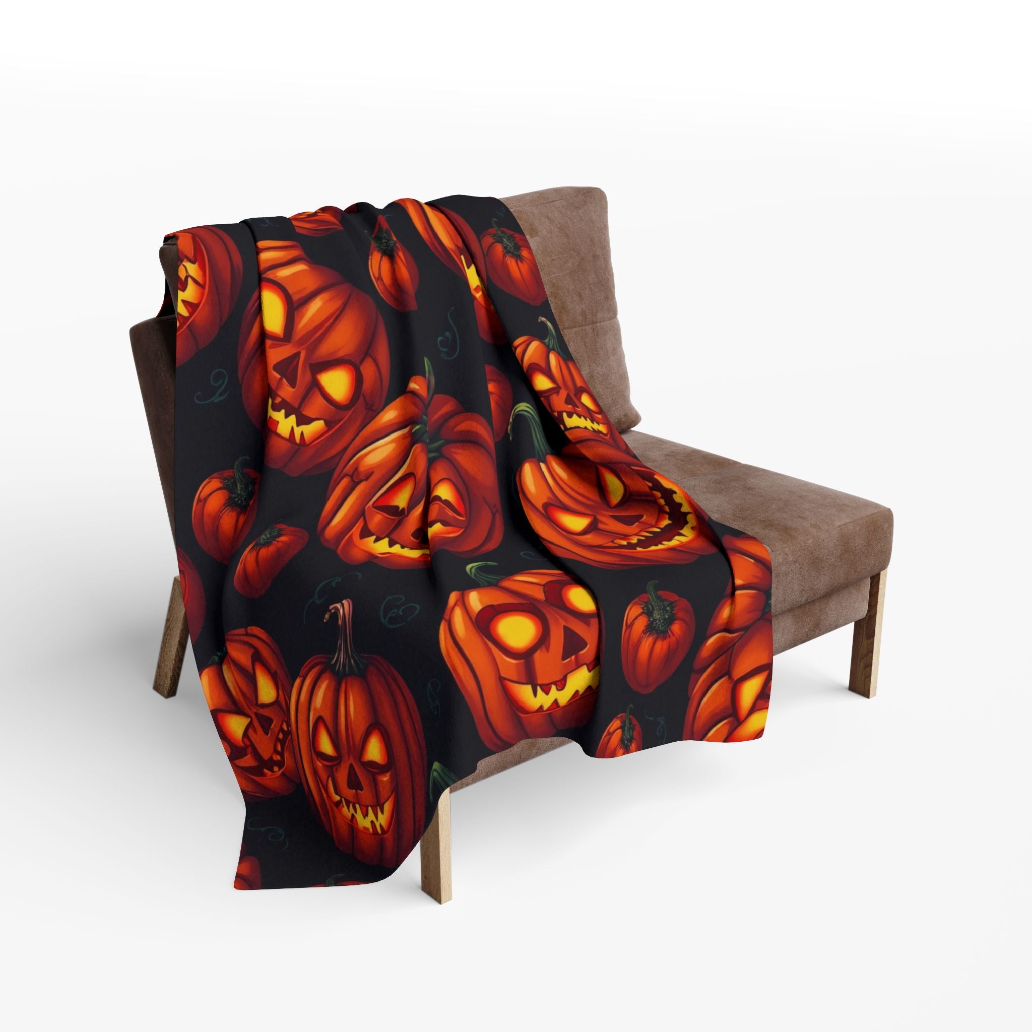 Halloween scary themed blanket with pumpkin lanterns draped over a chair.