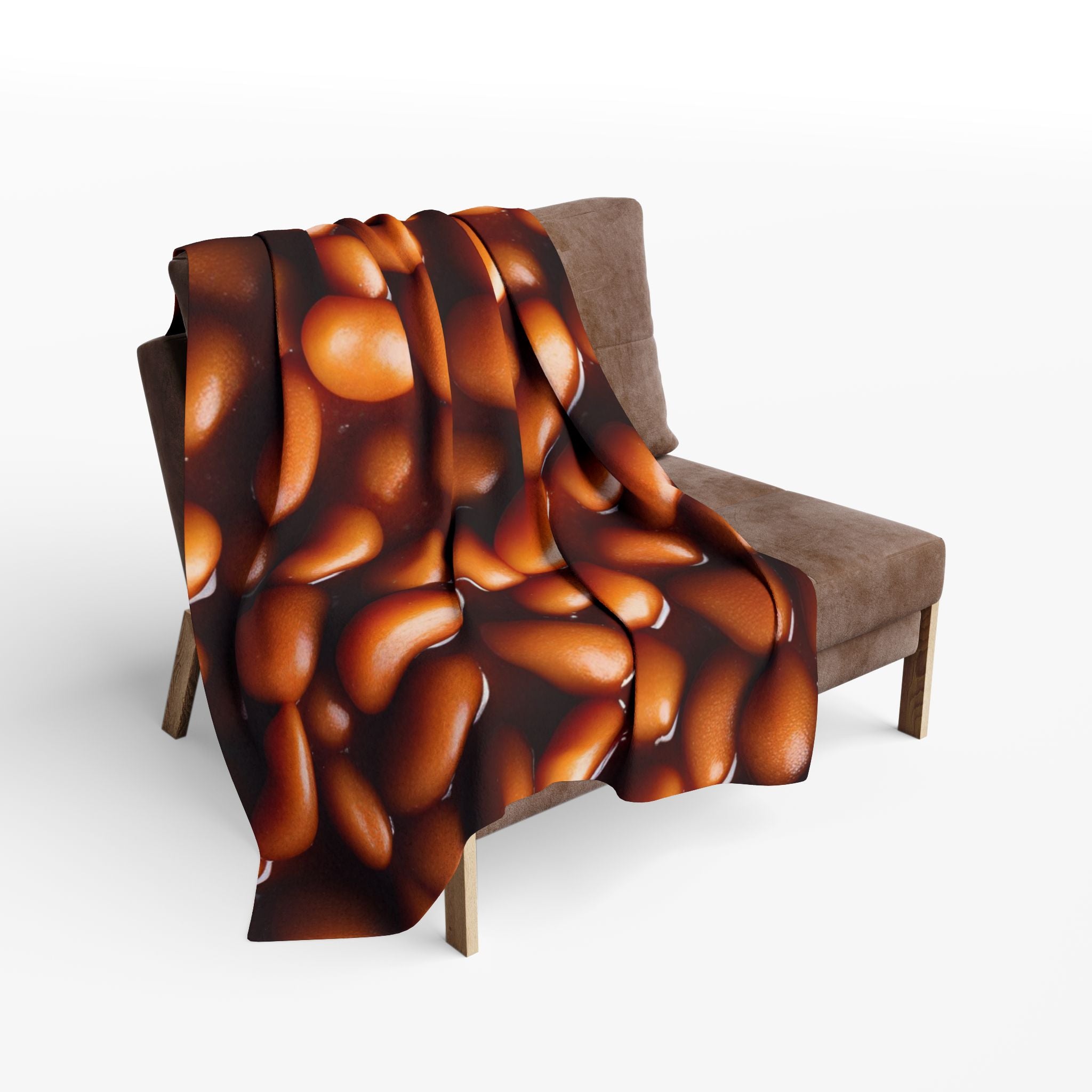 Baked beans textured blanket draped over a chair on a white background.