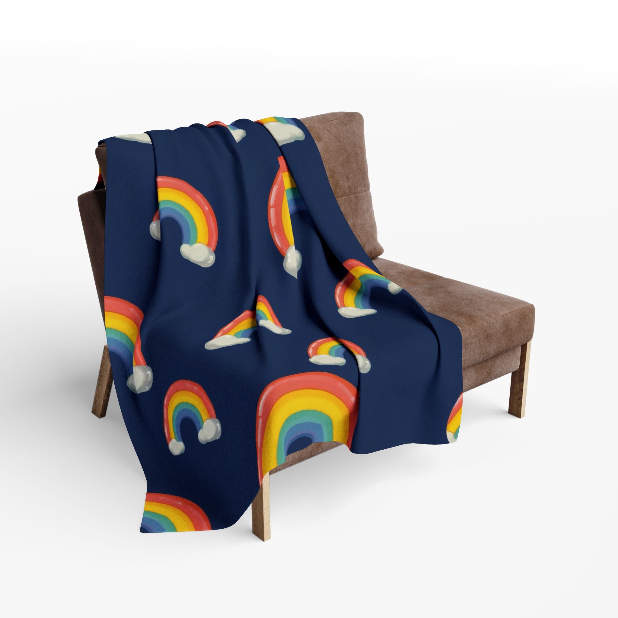 Navy blue blanket with colorful rainbow patterns draped over a brown chair.