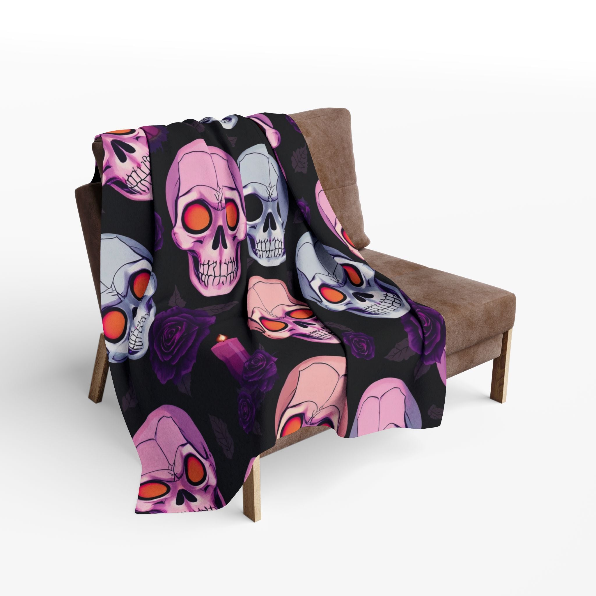 Colorful gothic halloween skull patterned blanket draped over a chair on a white background.