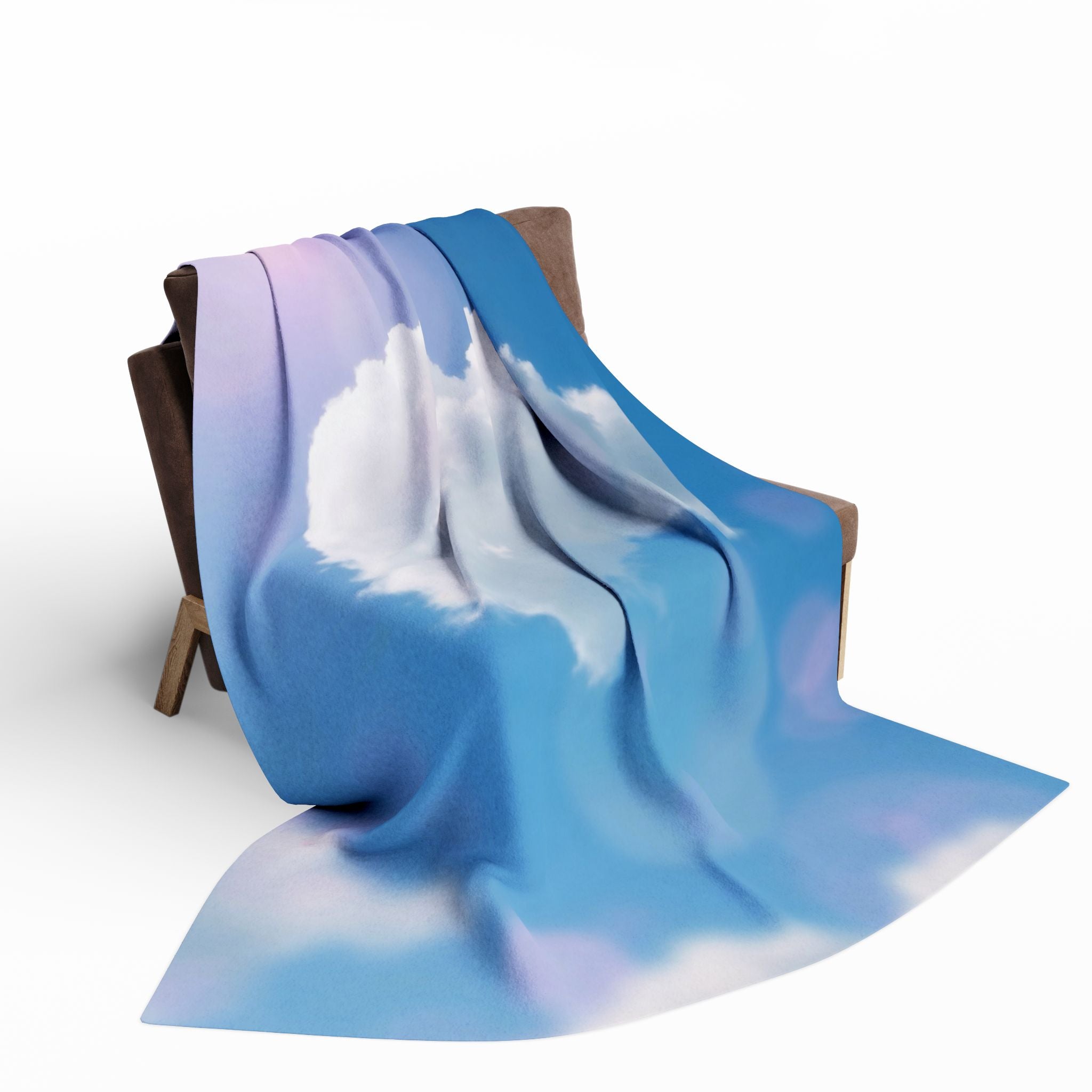 White heart shaped cloud on a blue and purple sky fleece blanket draped over a chair on a white background.