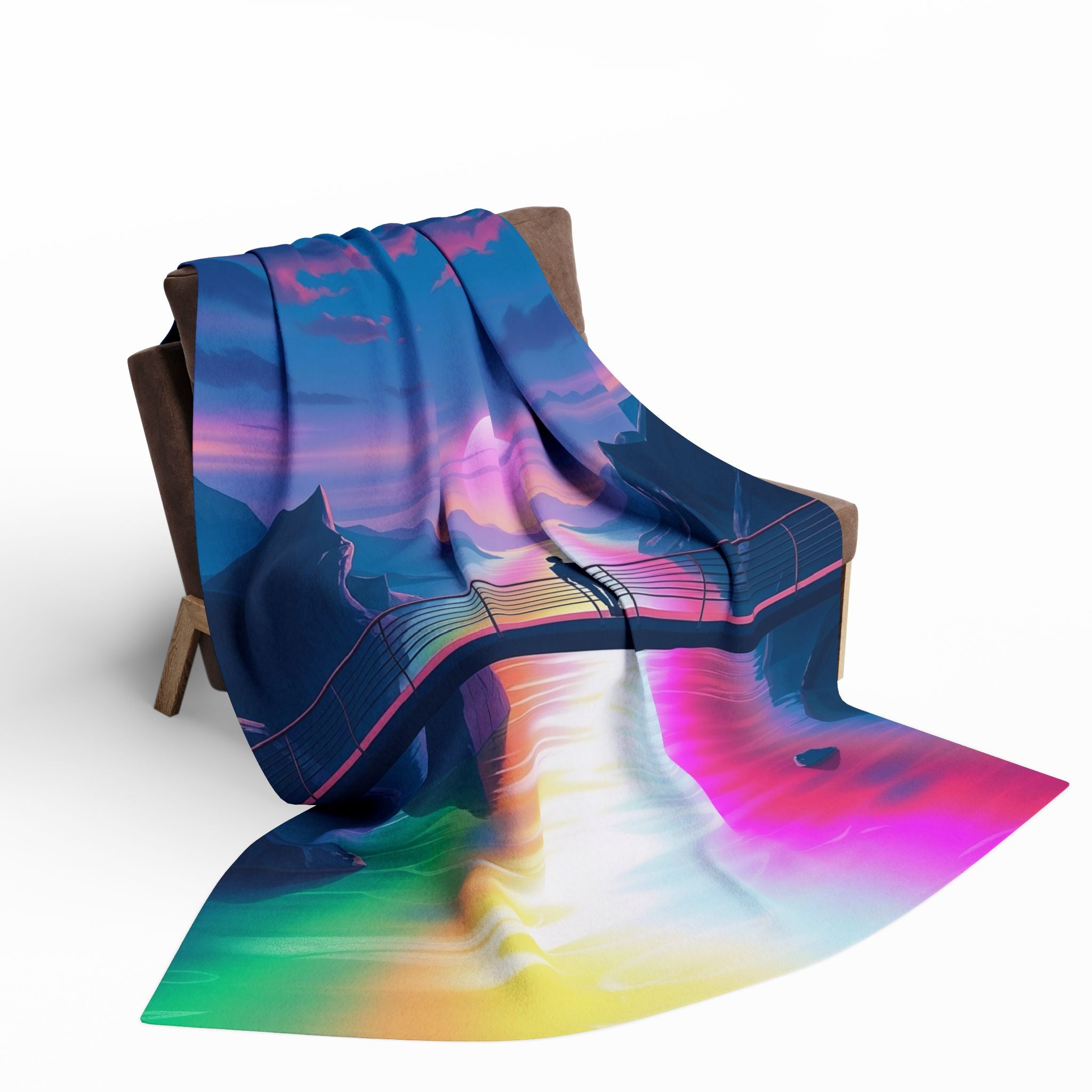 Colorful abstract sunset design blanket draped over a chair on a white background.