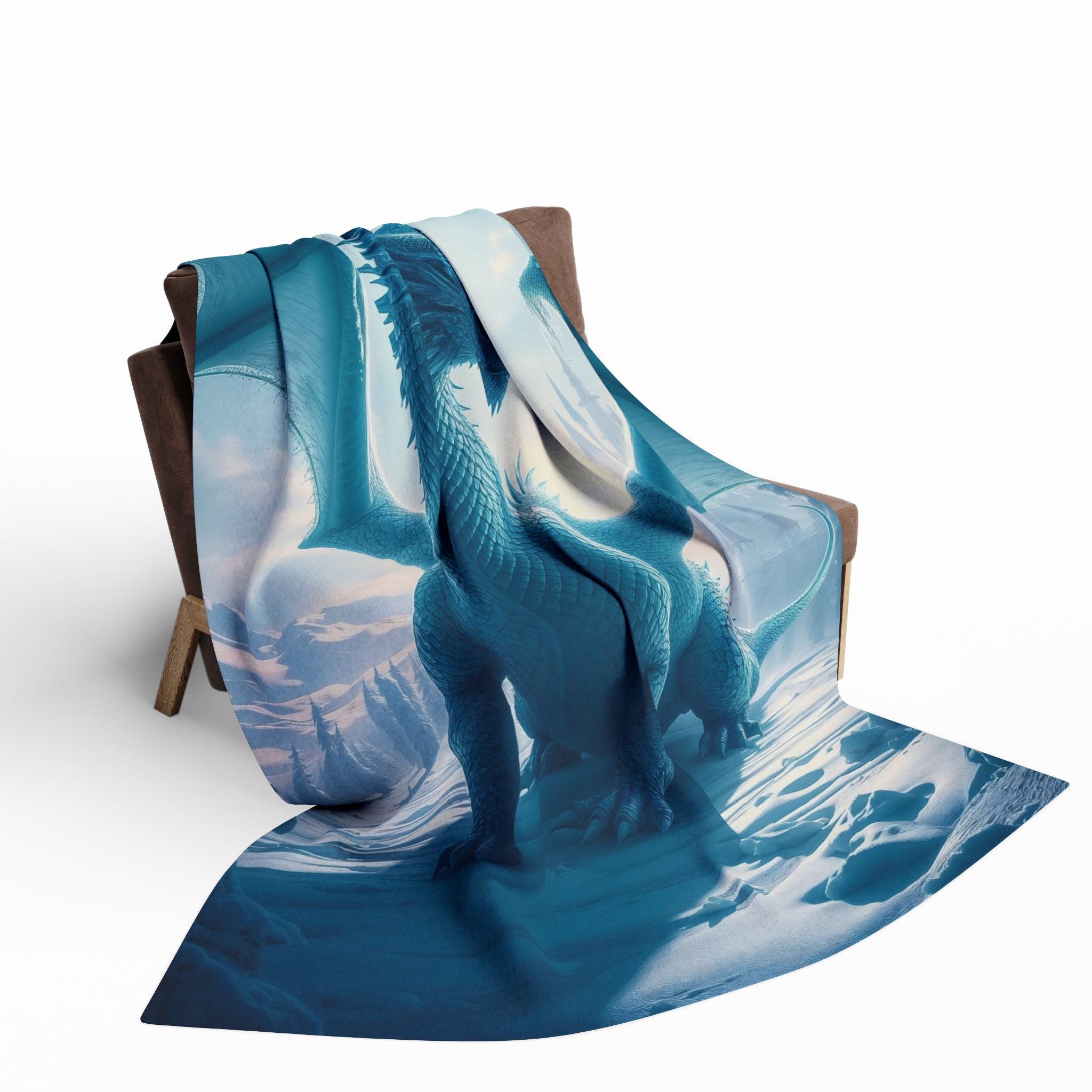 Blanket with a dragon in a mountain and snow scene draped over a chair on a white background.