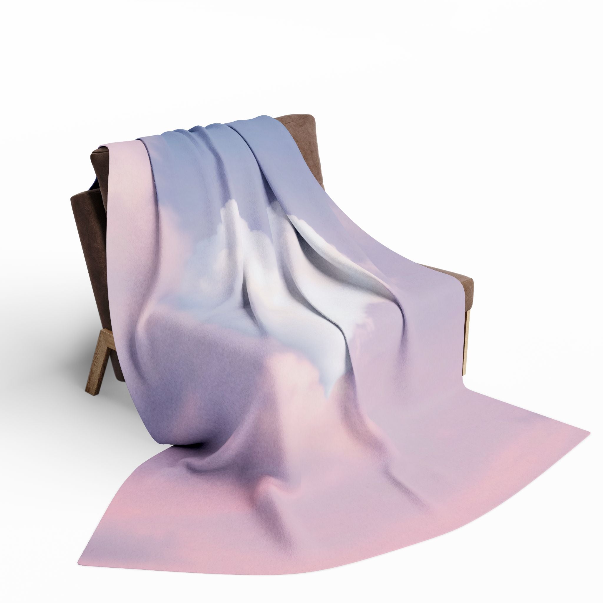 Heart shaped cloud fleece blanket draped over a chair on a white background.