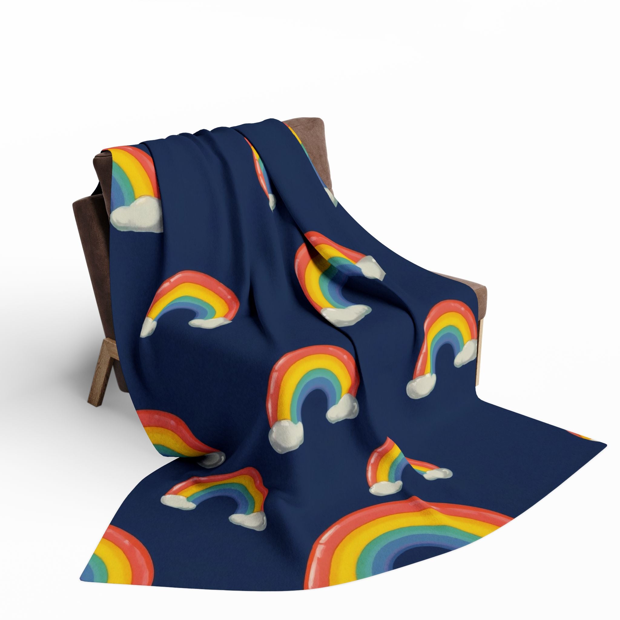 Navy blue blanket with colorful rainbow patterns draped over a wooden chair.