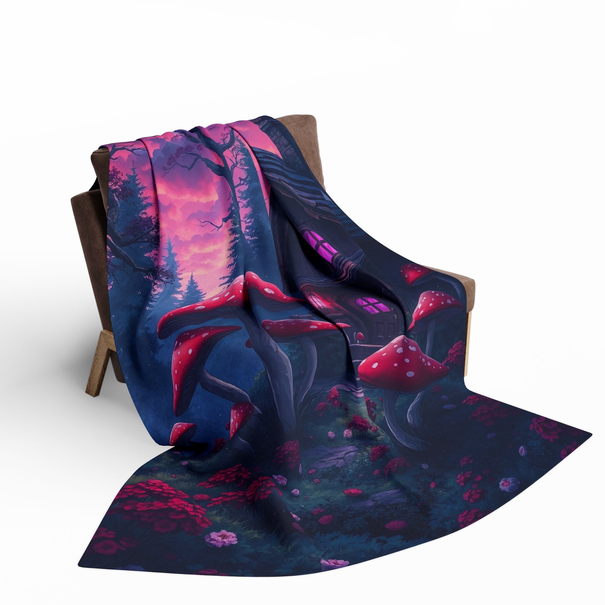 Fleece blanket throw featuring a halloween haunted house with mushrooms draped over a chair on a white background.