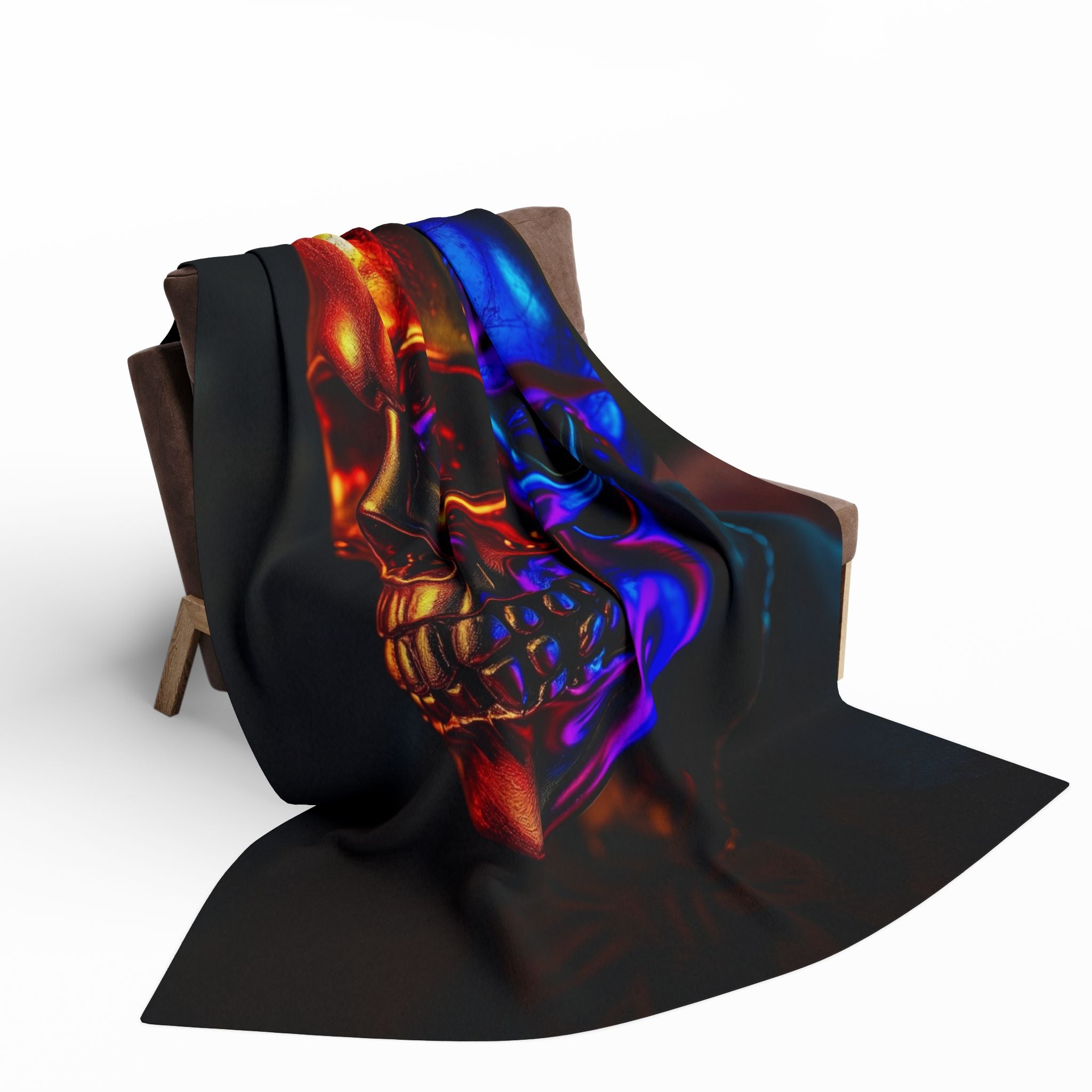 Black fleece blanket with a design of an ultraviolet luminous golden skull on a wooden chair against a white background.