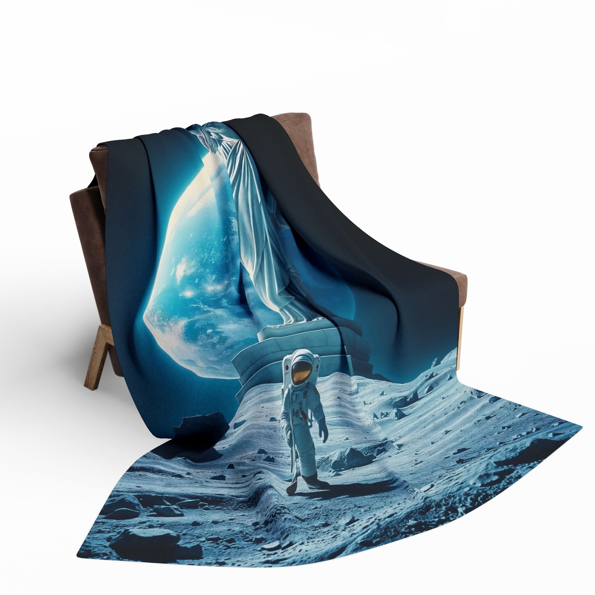 Fleece blanket with the statue of liberty and astronaut on the moon design draped over a chair.