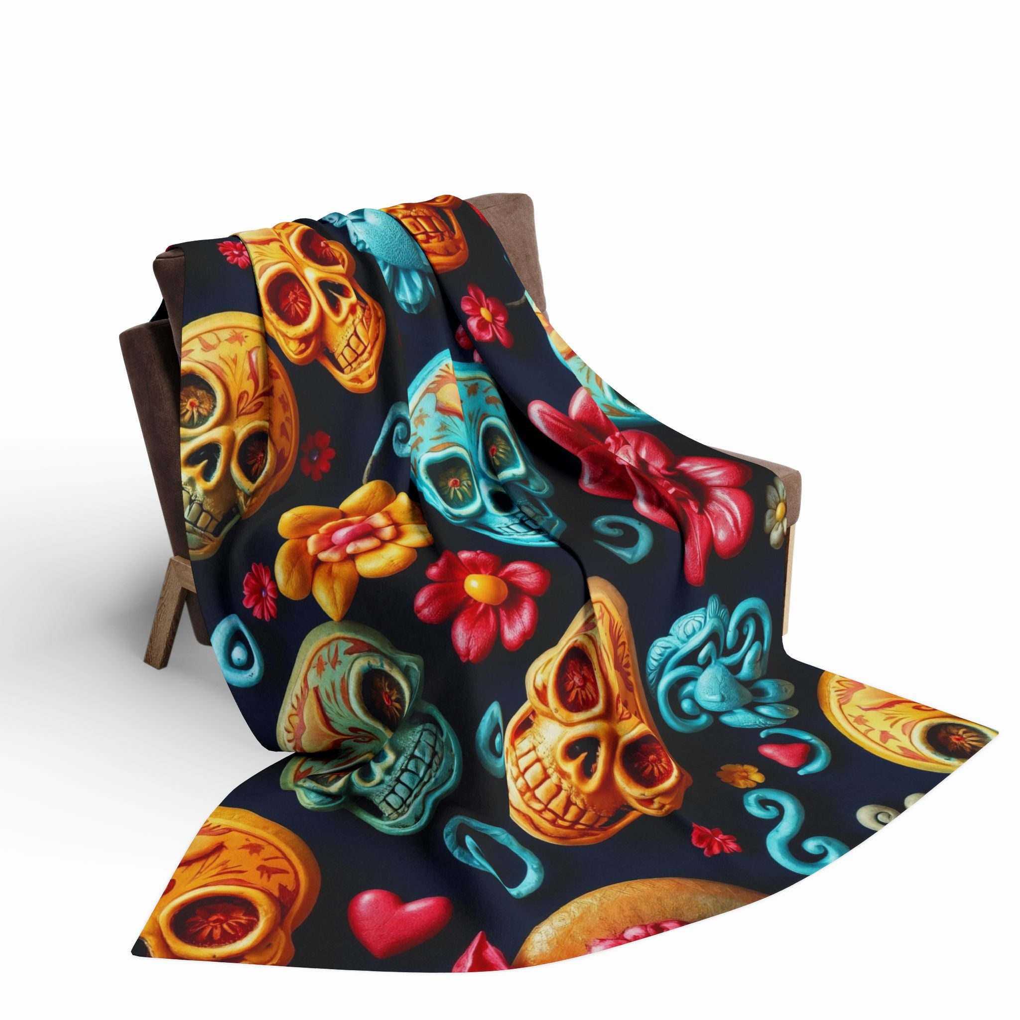 Colorful mexican day of the dead sugar skull and floral patterned fabric on a white background.