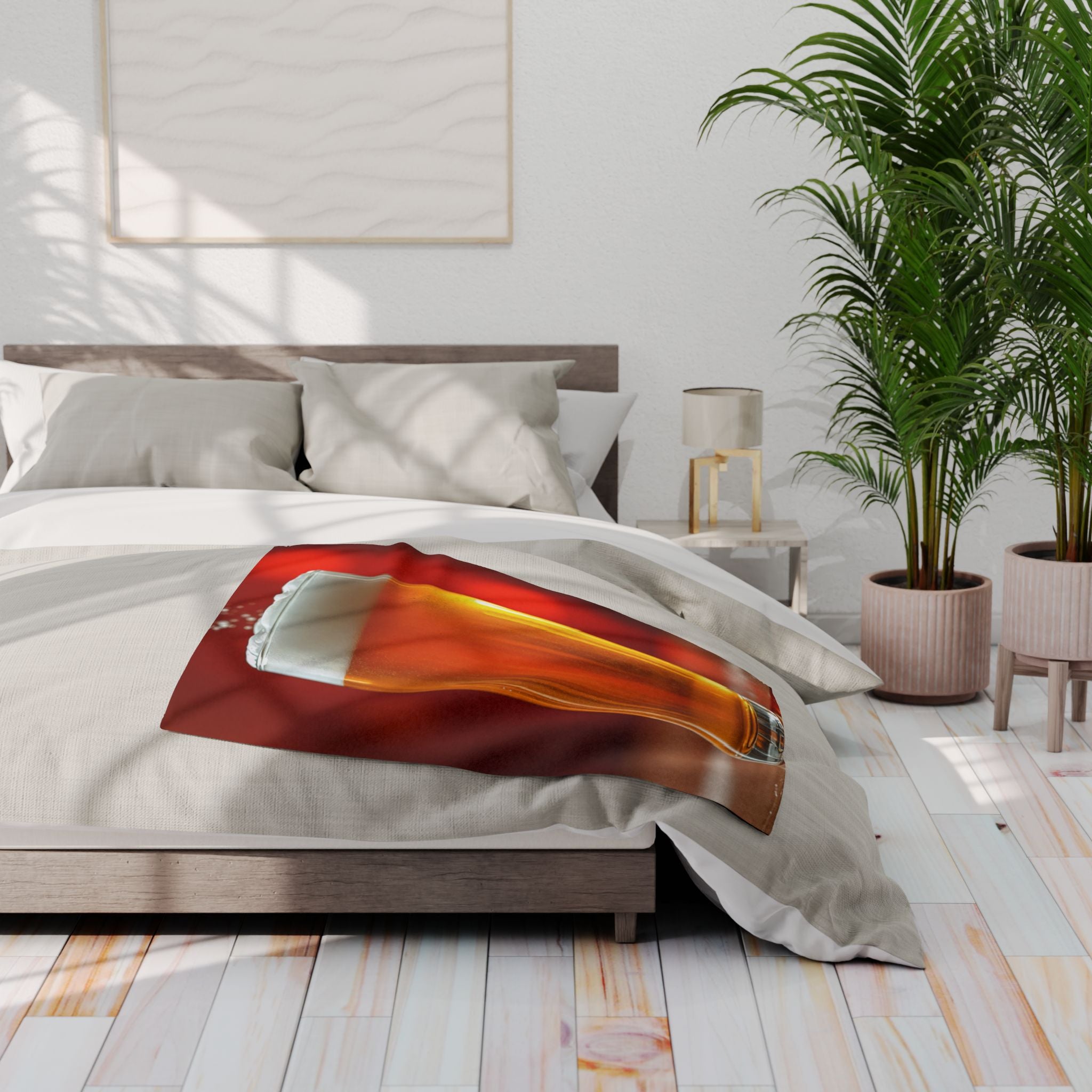 Bedroom with a printed fleece blanket of a glass pint of lager on a bed.