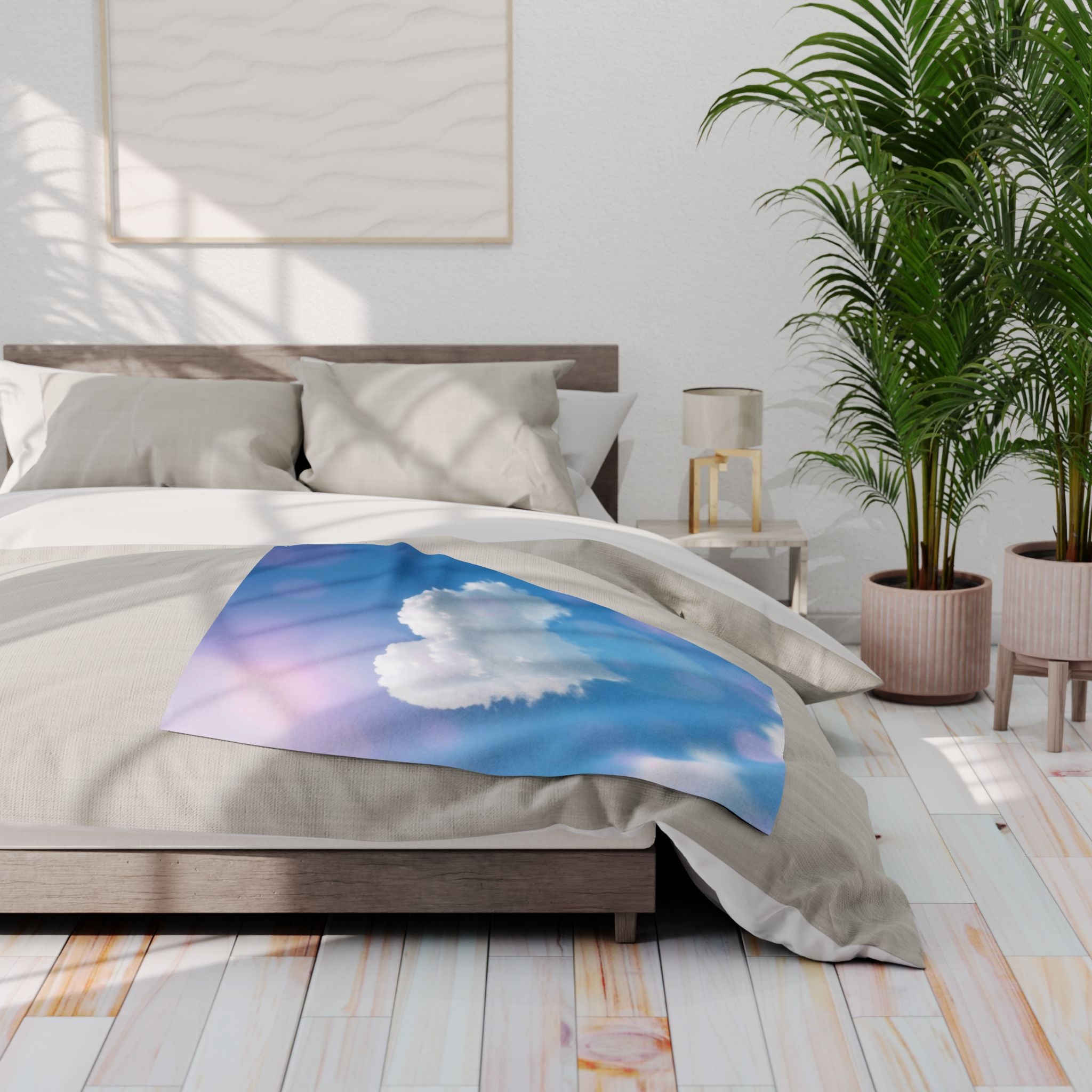 Bedroom with a bed featuring a heart shaped cloud fleece blanket, nightstands, and plants.