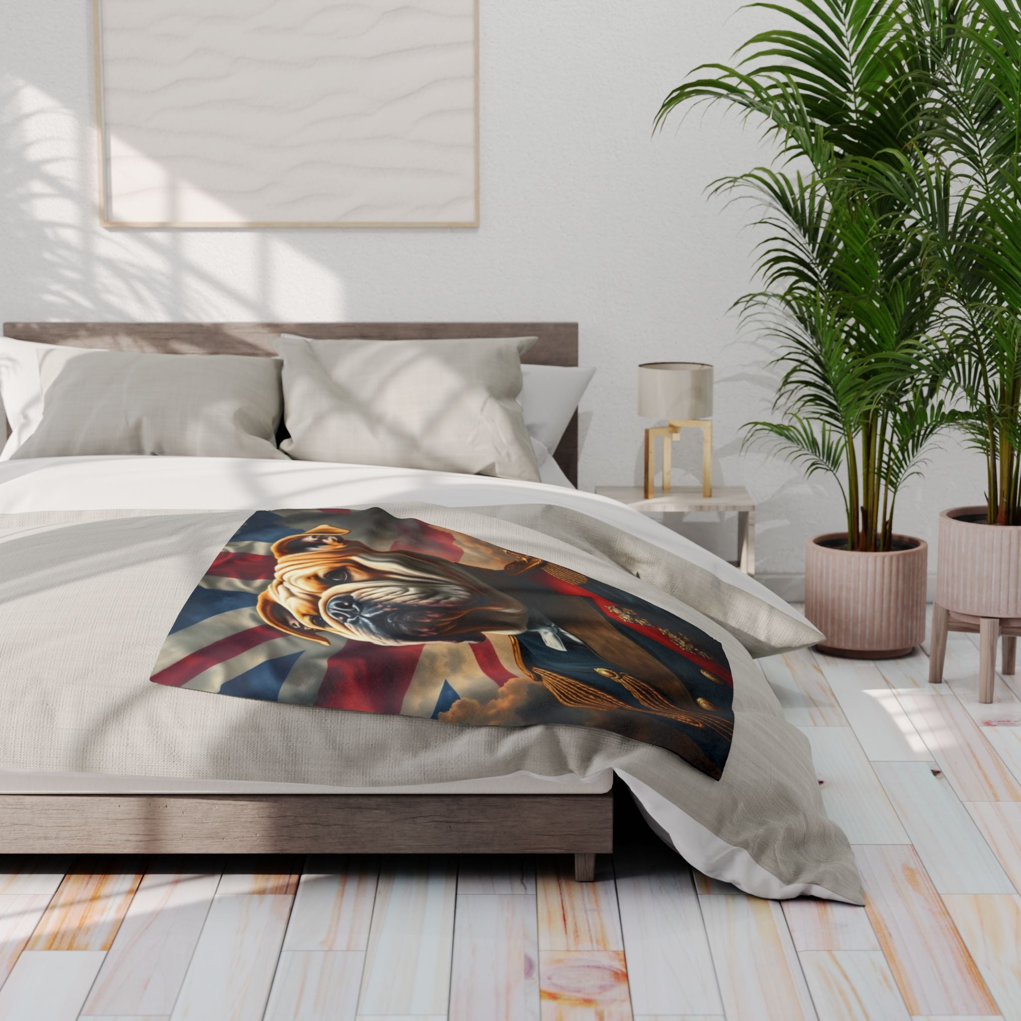 Bedroom with a bed featuring a decorative blanket of a British bulldog wearing an army uniform and Union Jack flag design and a plant in the corner.