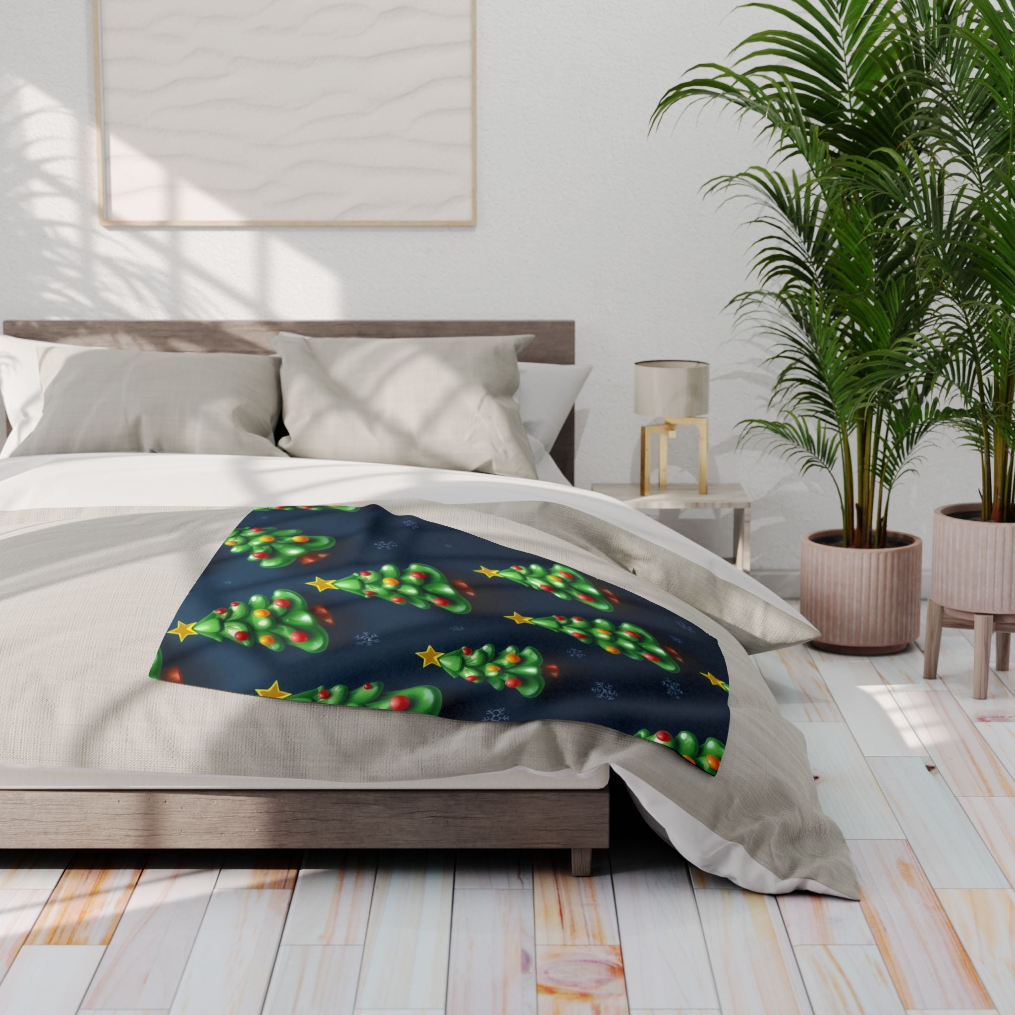 Bed with a festive blanket featuring green christmas trees and stars, in a bright bedroom setting.