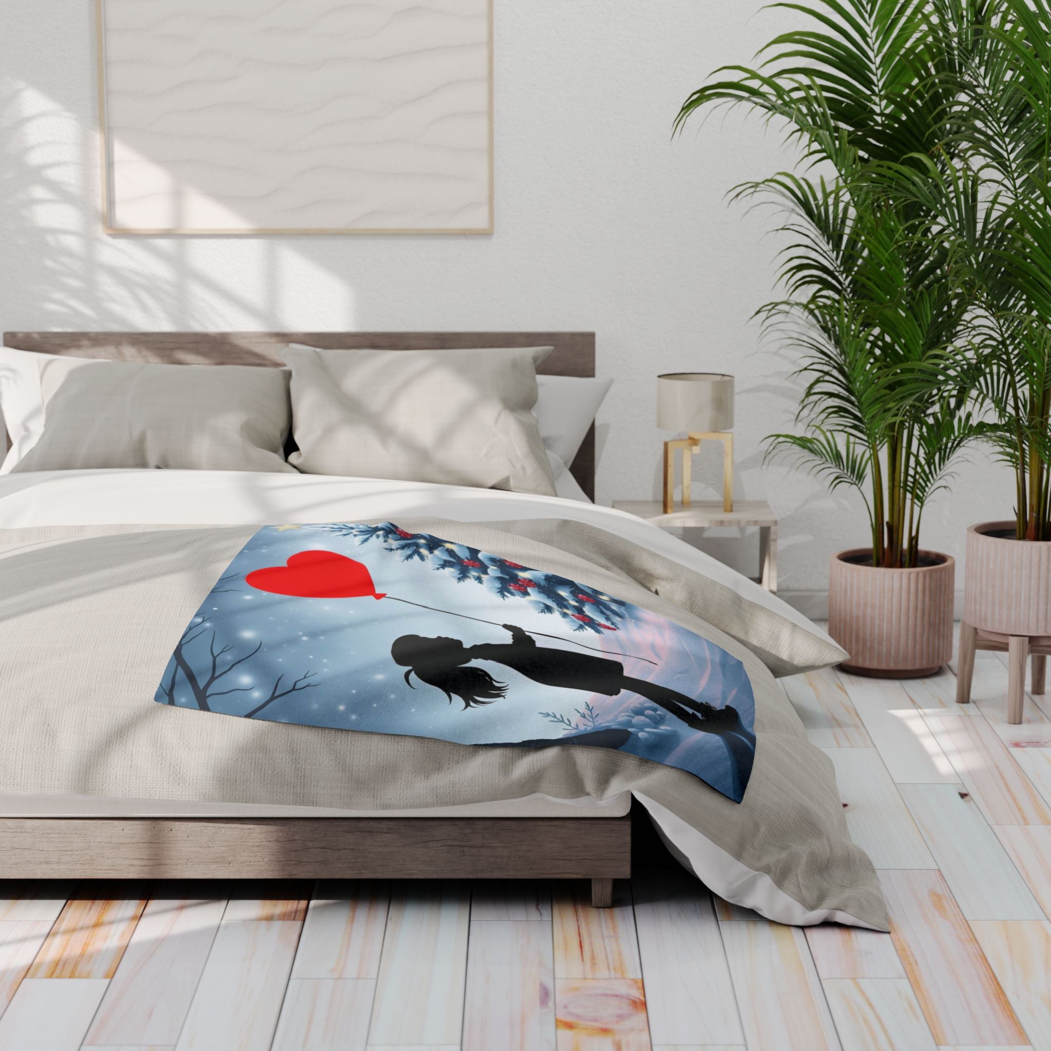 Bed with a decorative blanket featuring a heart balloon banksy street art design in a bedroom setting.