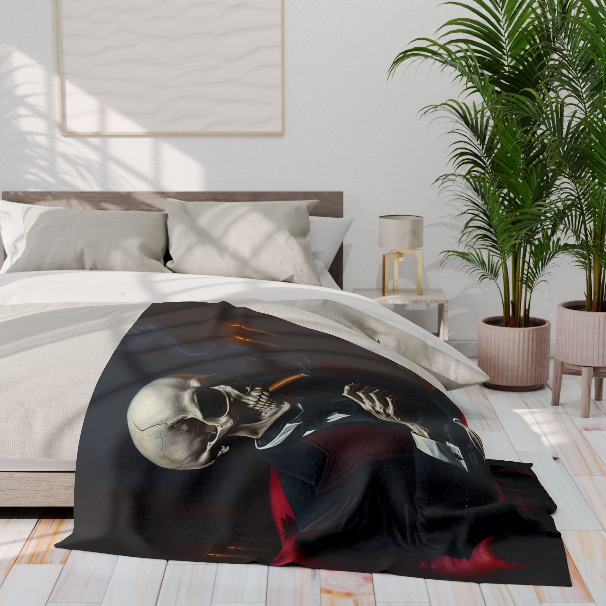 Bed with a skull design blanket in a bedroom setting.
