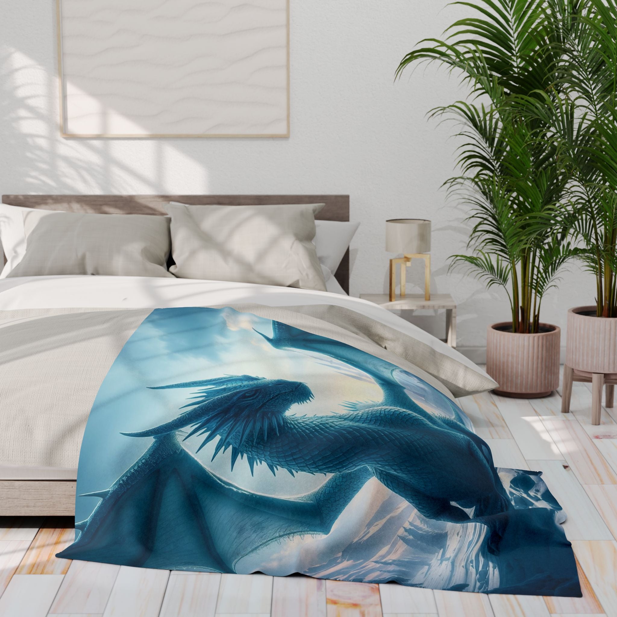 Blue ice dragon art blanket draped over a bed in a bedroom setting with plants and a lamp.