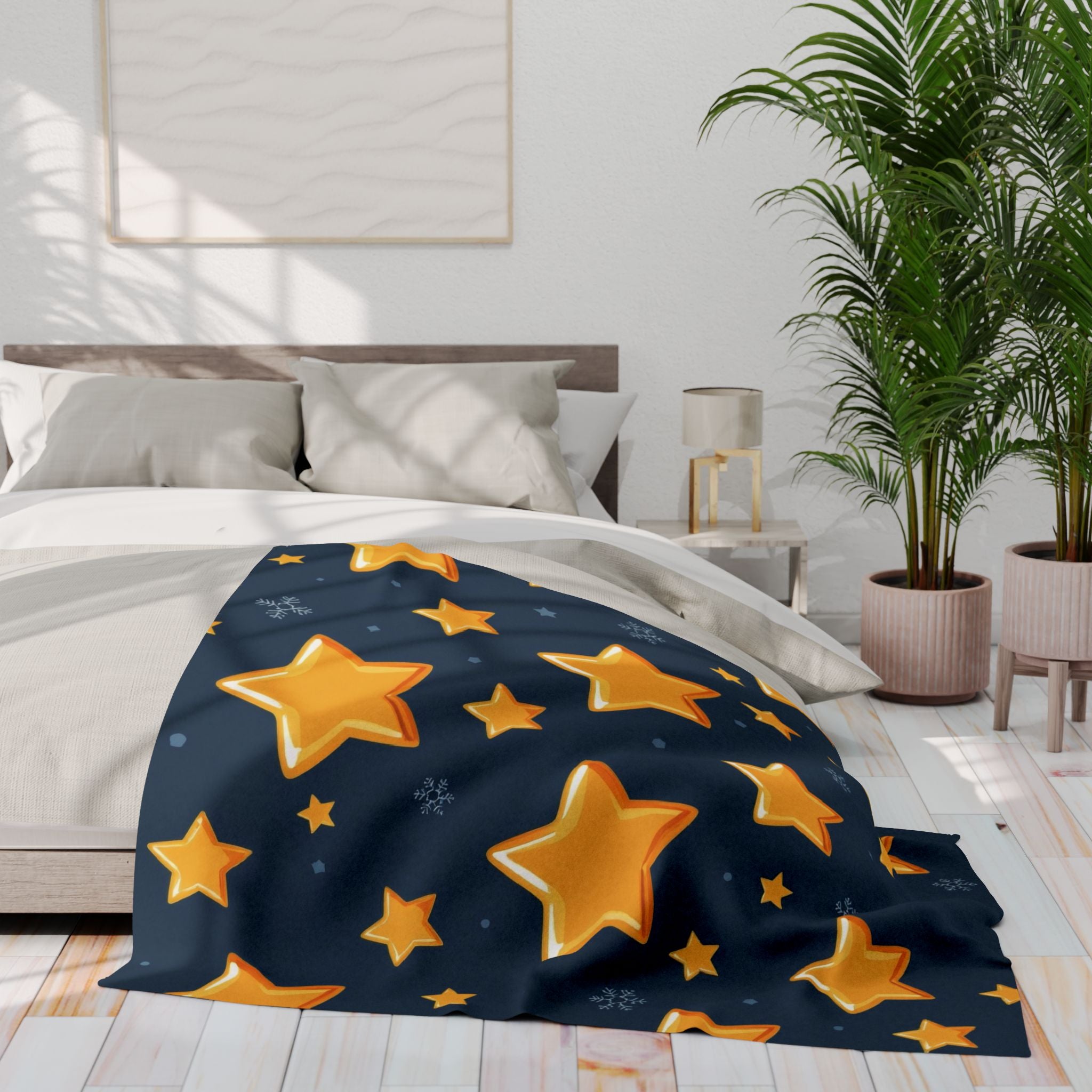 Star-patterned blanket on a bed in a bright bedroom with plants and decor.