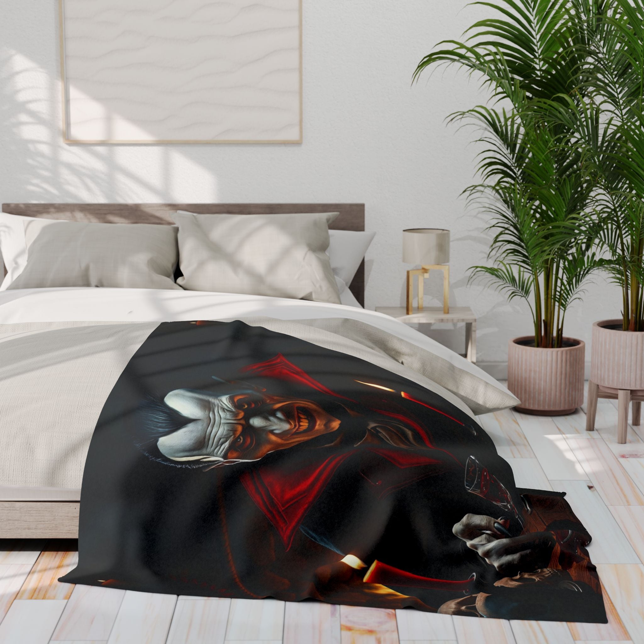 Bed with a halloween themed count dracula fleece blanket, in a room with a plant and lamp.