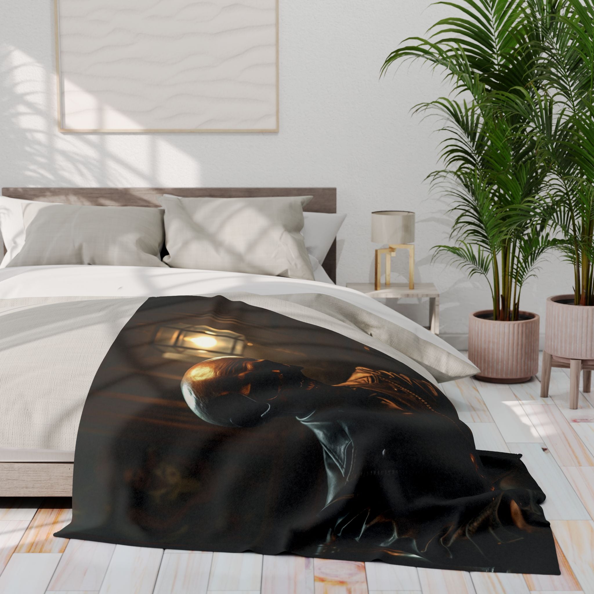 Bed with a black gothic blanket featuring a skull design, in a bright bedroom setting.