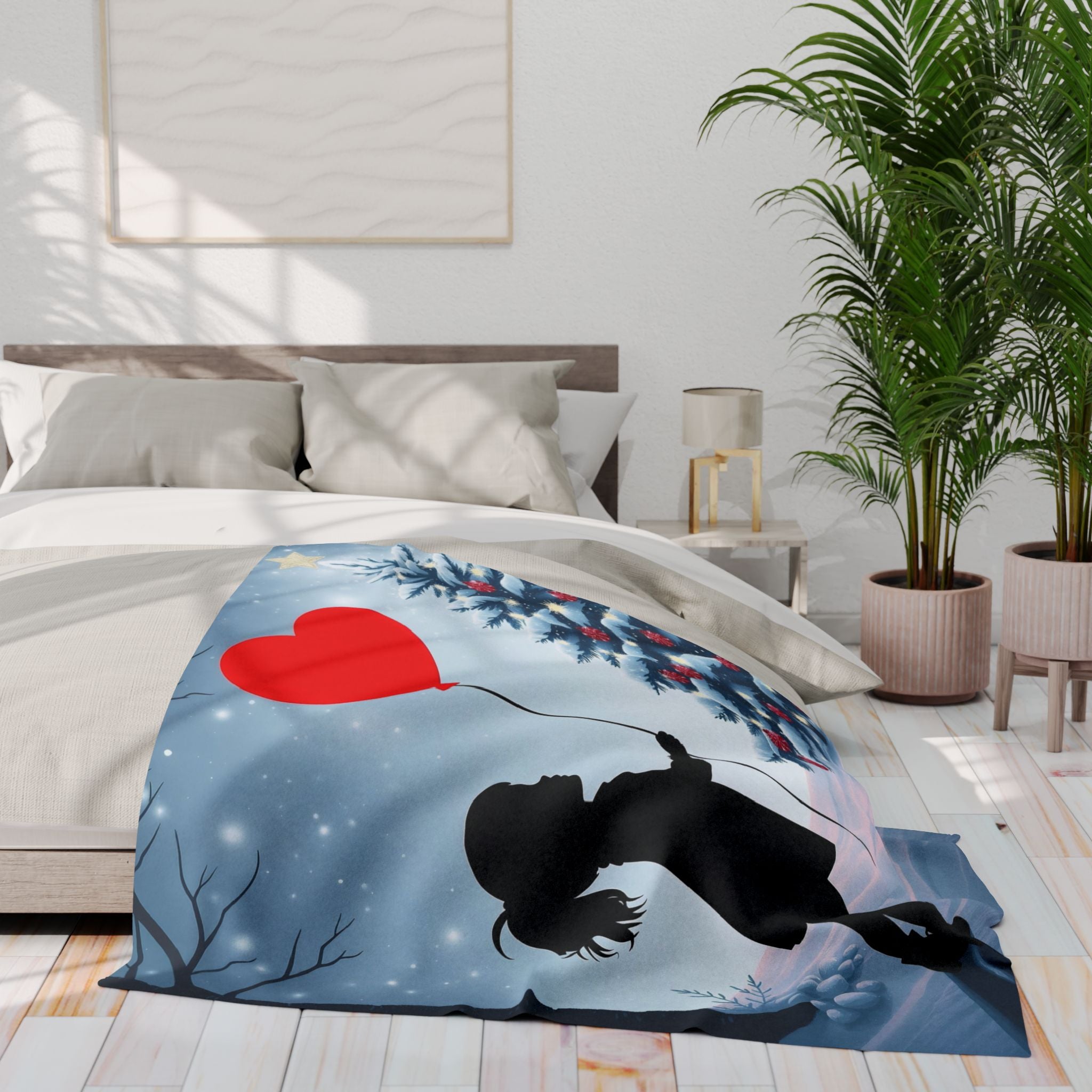 Blanket with a banksy street art heart design on a bed in a bedroom setting.