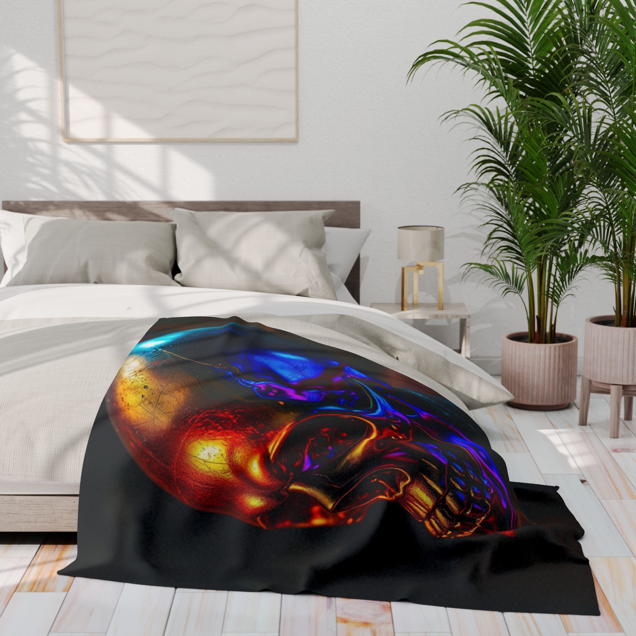 Golden purple and violet skull design blanket on a bed in a bedroom setting.