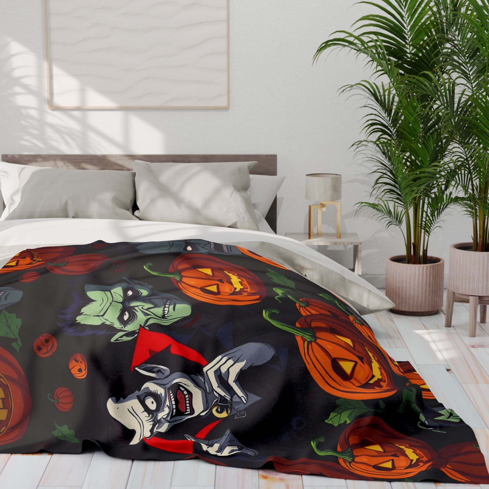 Bed with a colorful Halloween themed fleece blanket featuring Dracula, Frankenstein and spooky pumpkin lanterns in a modern bedroom.