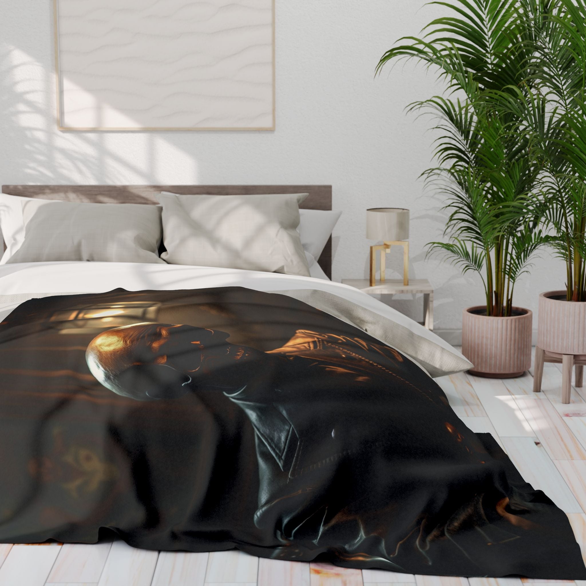 Black skull blanket draped over a bed in a modern bedroom with plants and a lamp.