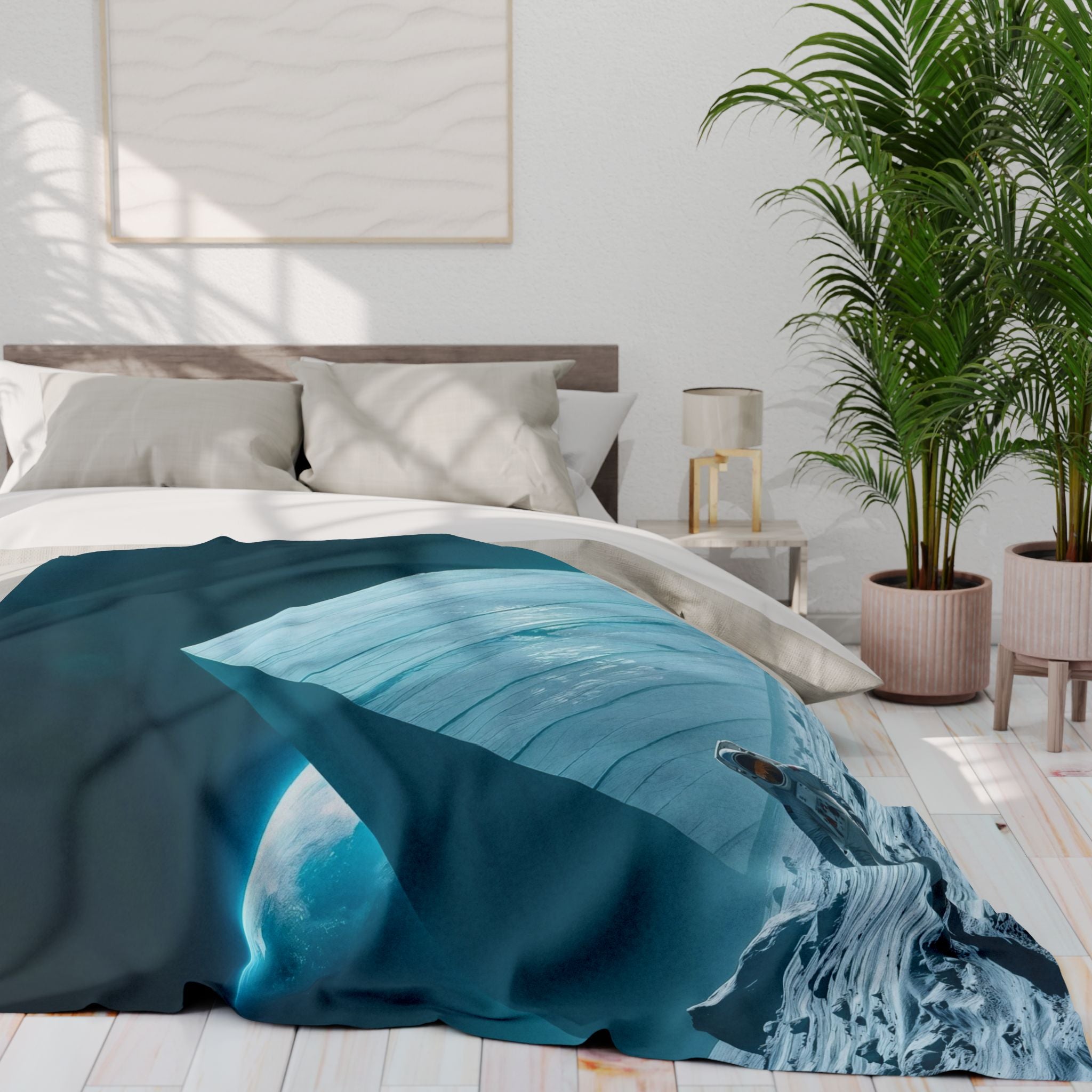 Bed with a fleece blanket featuring an astronaut on the moon with a huge ancient pyramid in a bright bedroom.