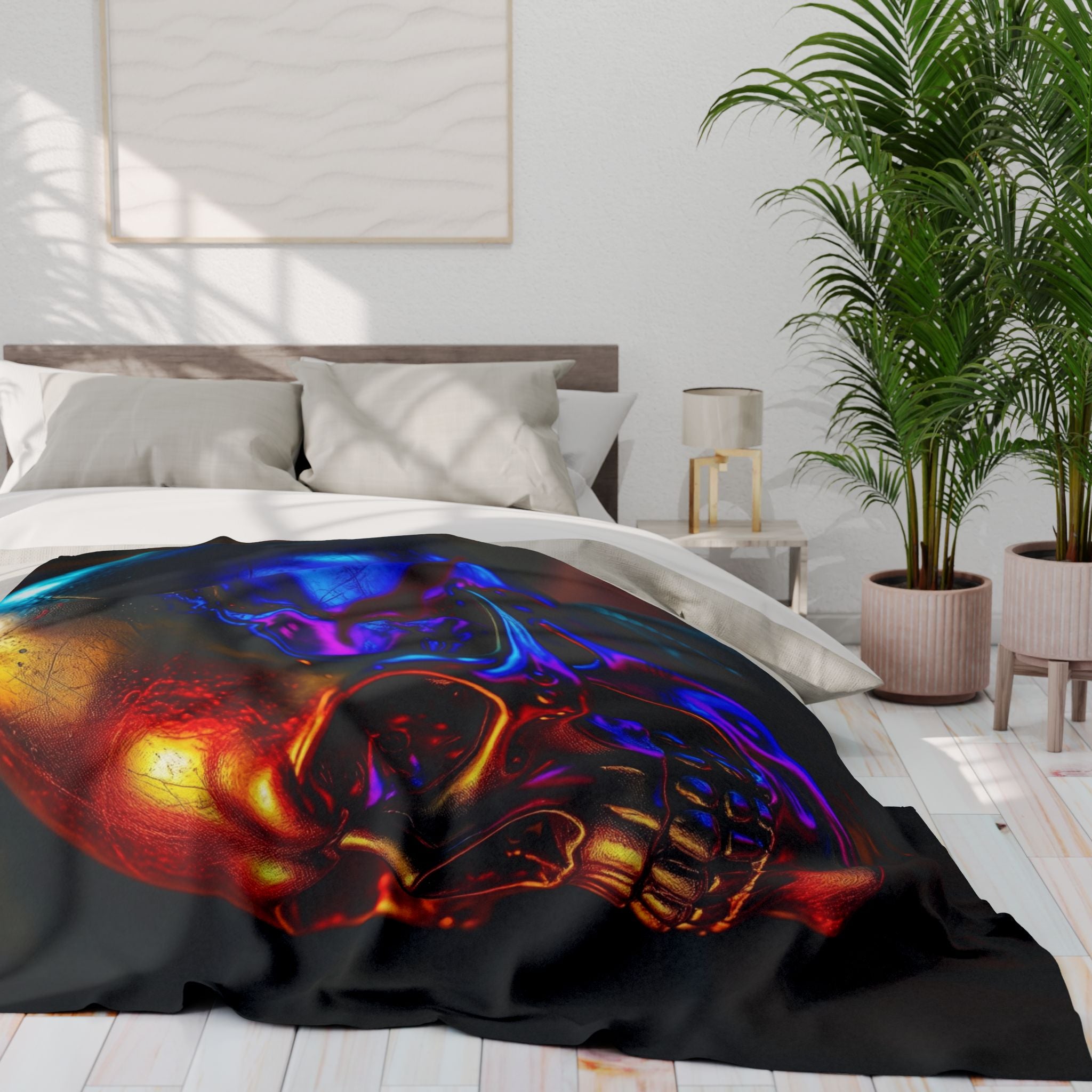 Golden ultraviolet luminous skull blanket on a bed in a bedroom with plants and a lamp.