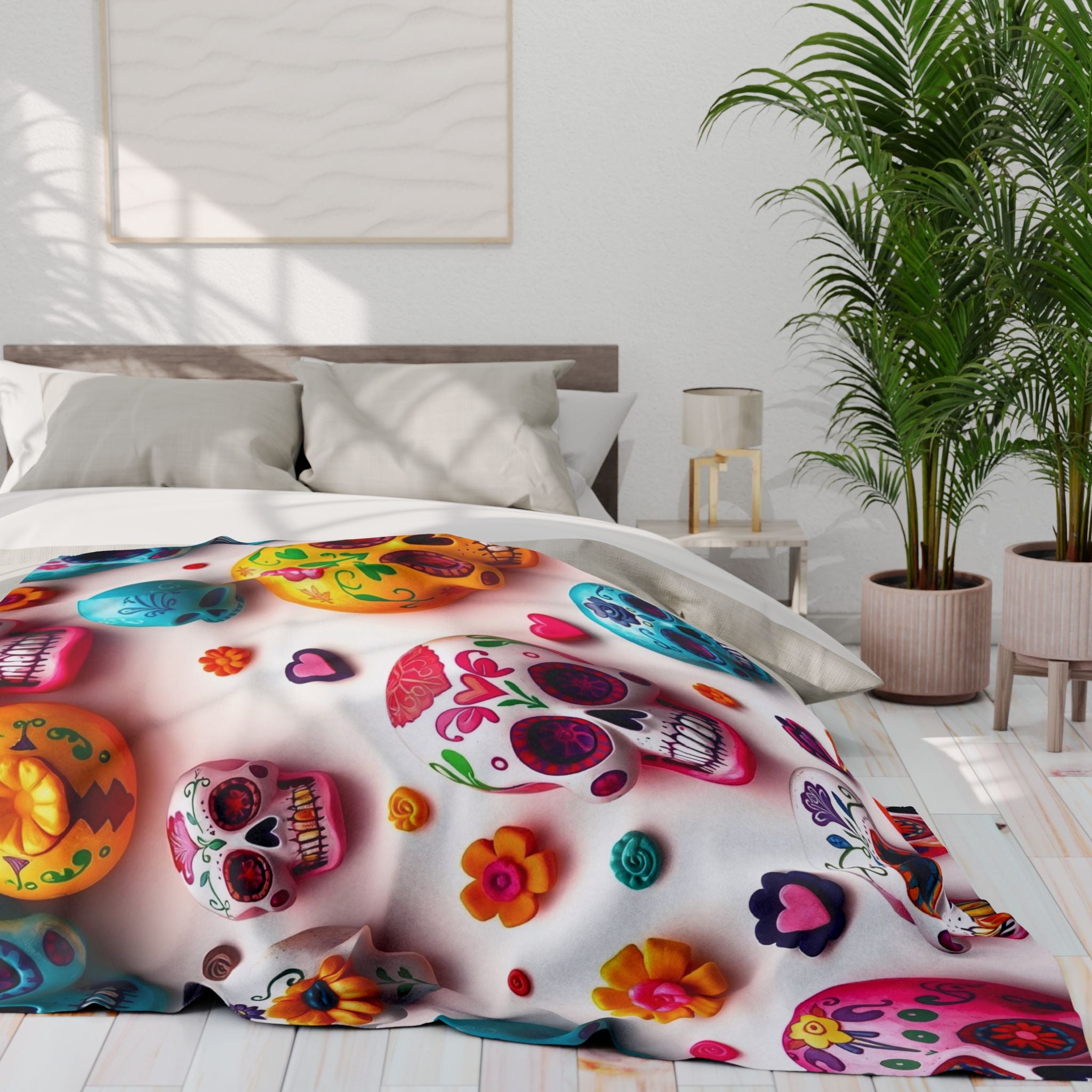 Colorful mexican day of the dead sugar skull and floral patterned fleece blanket throw on a bed in a bright bedroom.