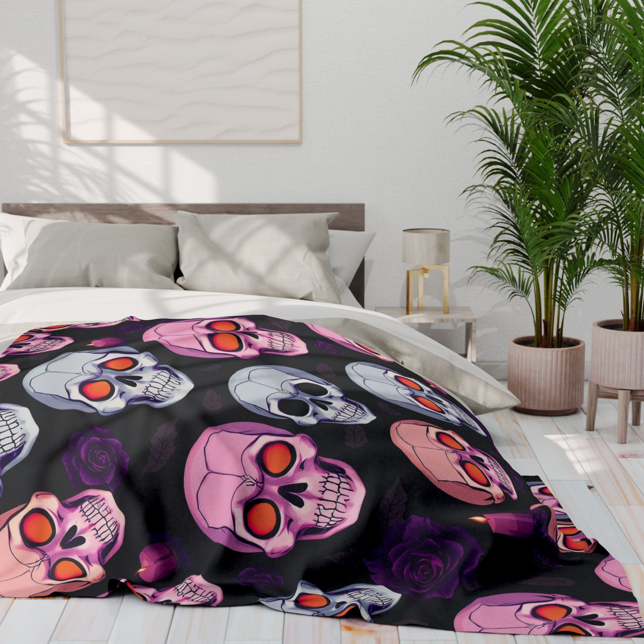 Colorful halloween skull and rose patterned fleece blanket on a bed in a bedroom setting.