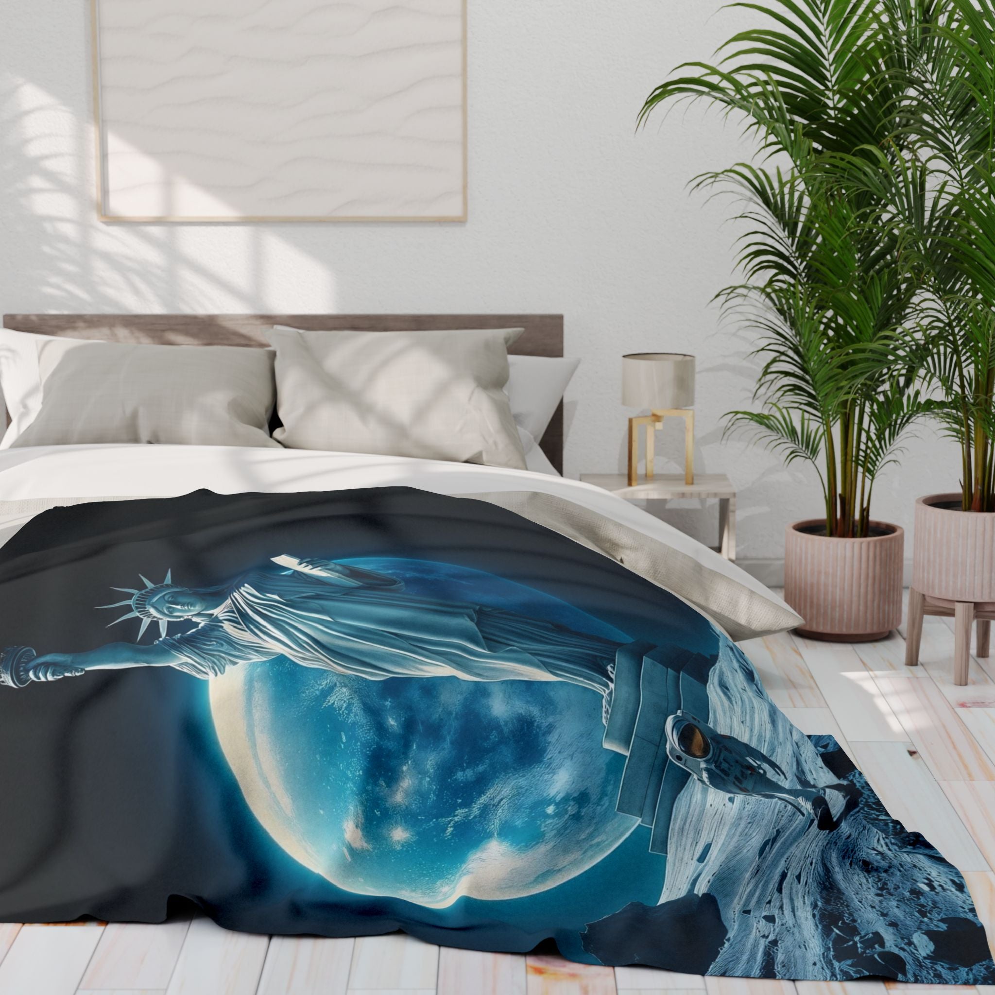 Bed with a decorative fleece blanket featuring  the statue of liberty and an astronaut on the moon design, in a bedroom setting.