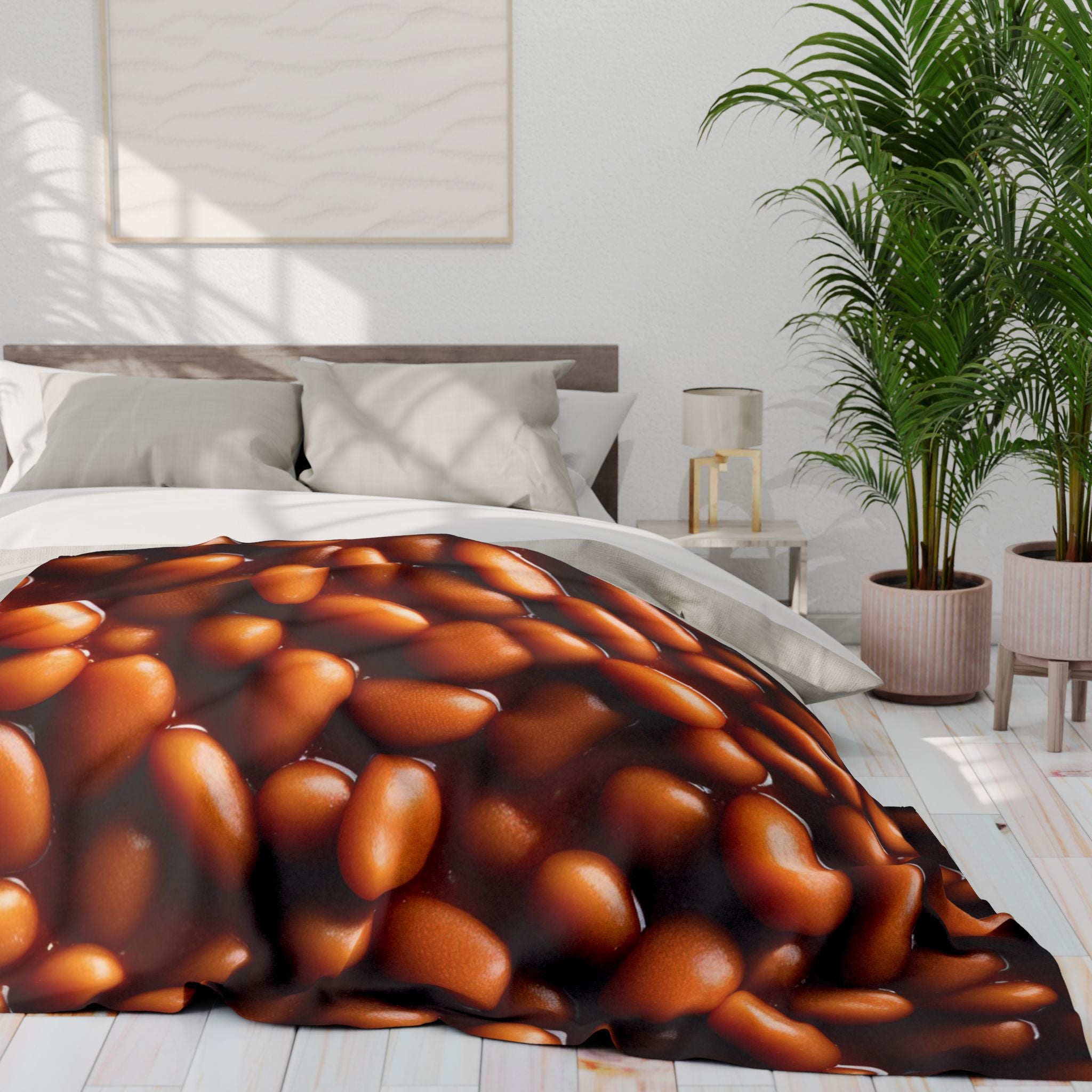 Bed with a unique baked beans patterned fleece blanket in a modern bedroom setting.