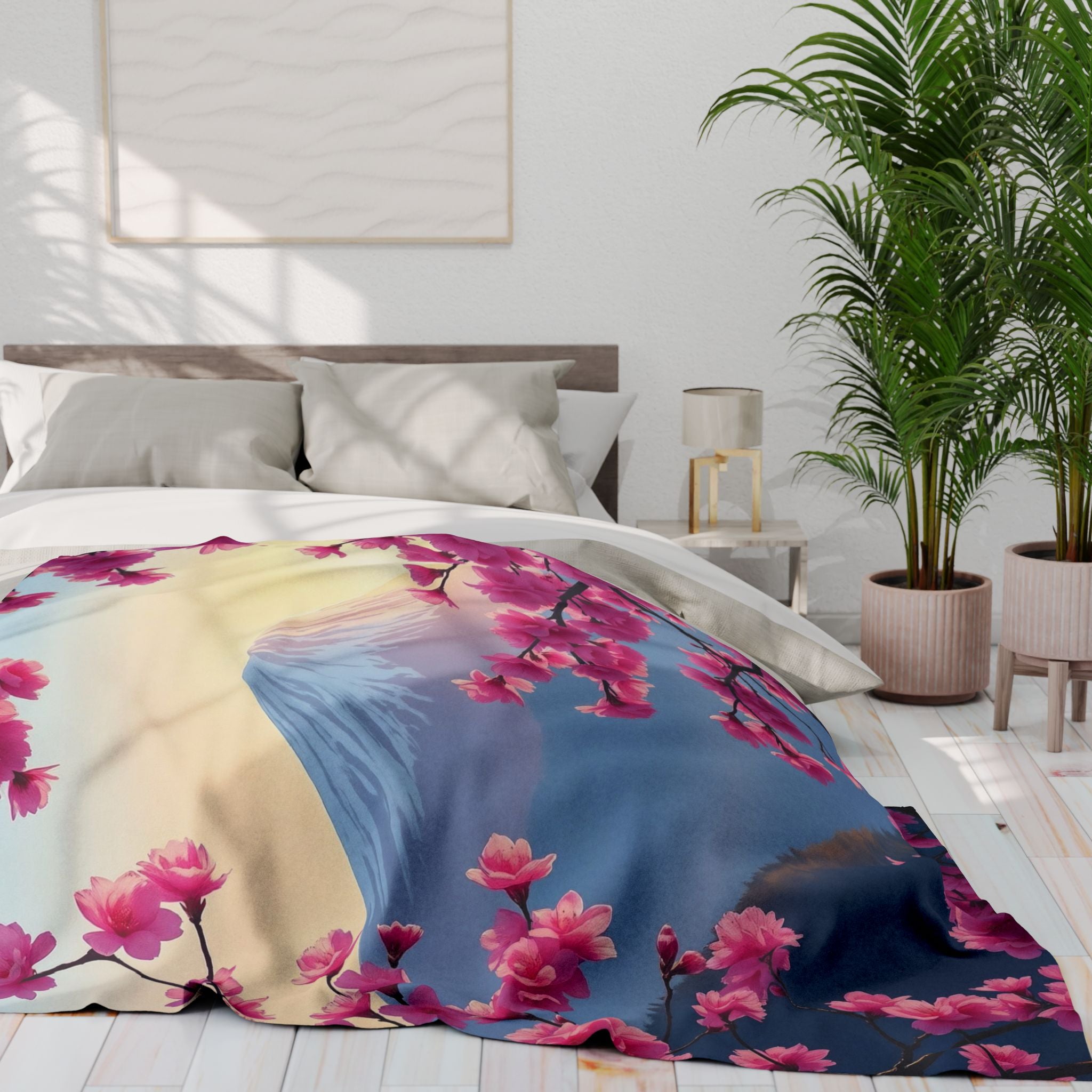 Bed featuring a fleece blanket with mount  fuji and pink cherry blossom in a bright bedroom.