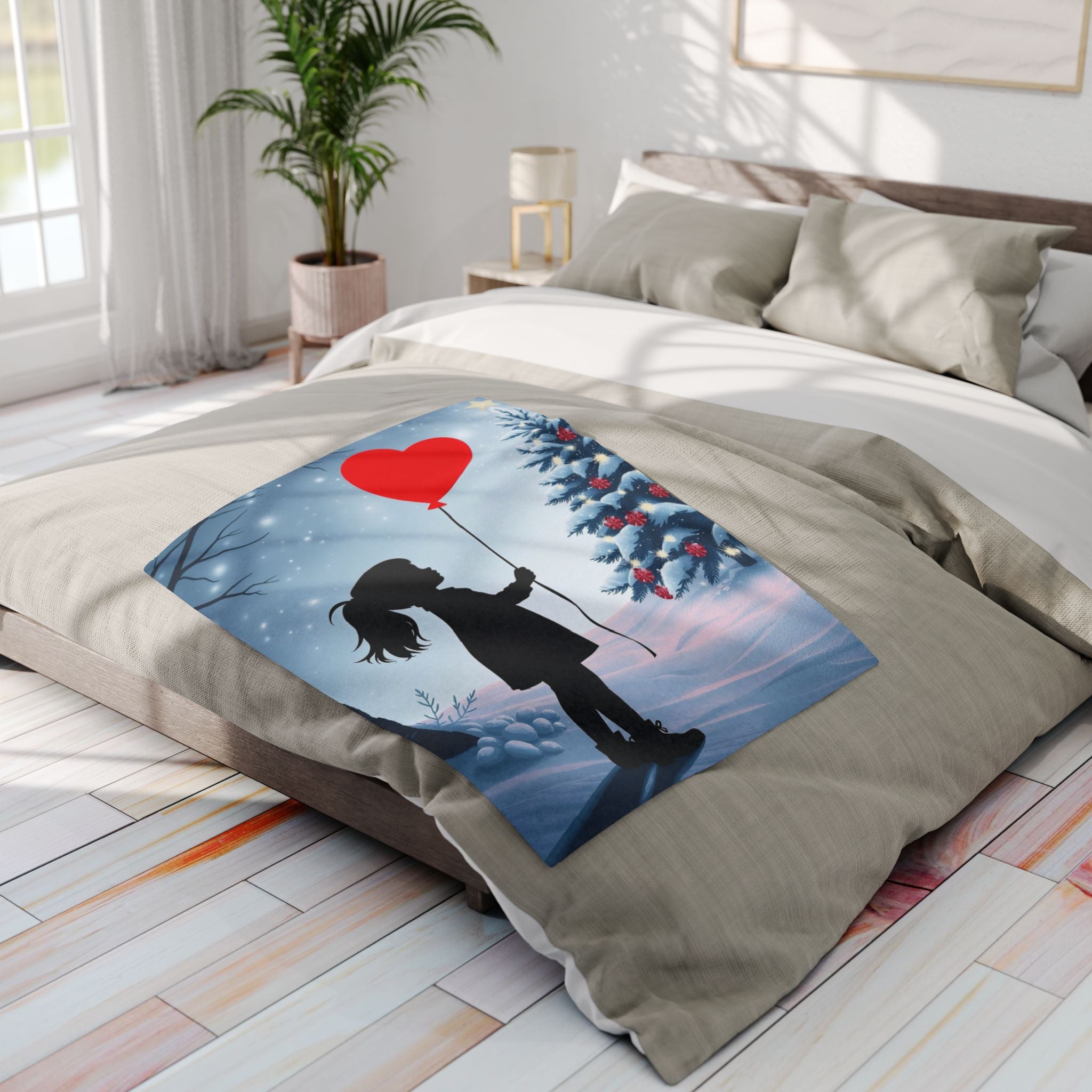 Decorative blanket with a street art heart design on a bed in a bright bedroom.