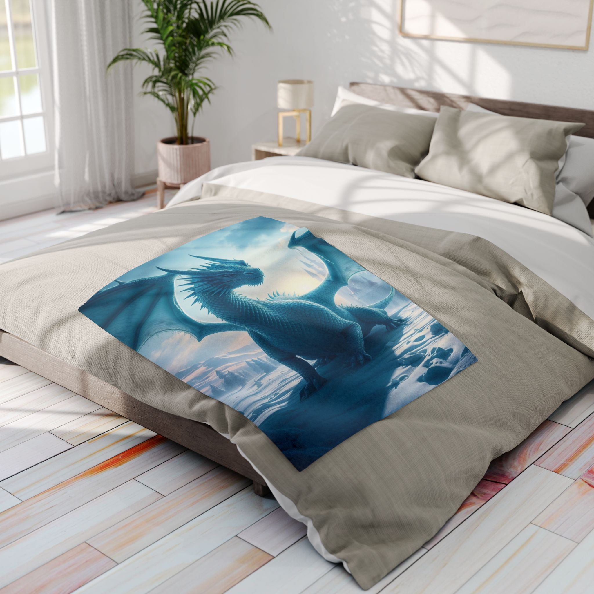 Bed with a dragon-themed fleece blanket in a bright bedroom.
