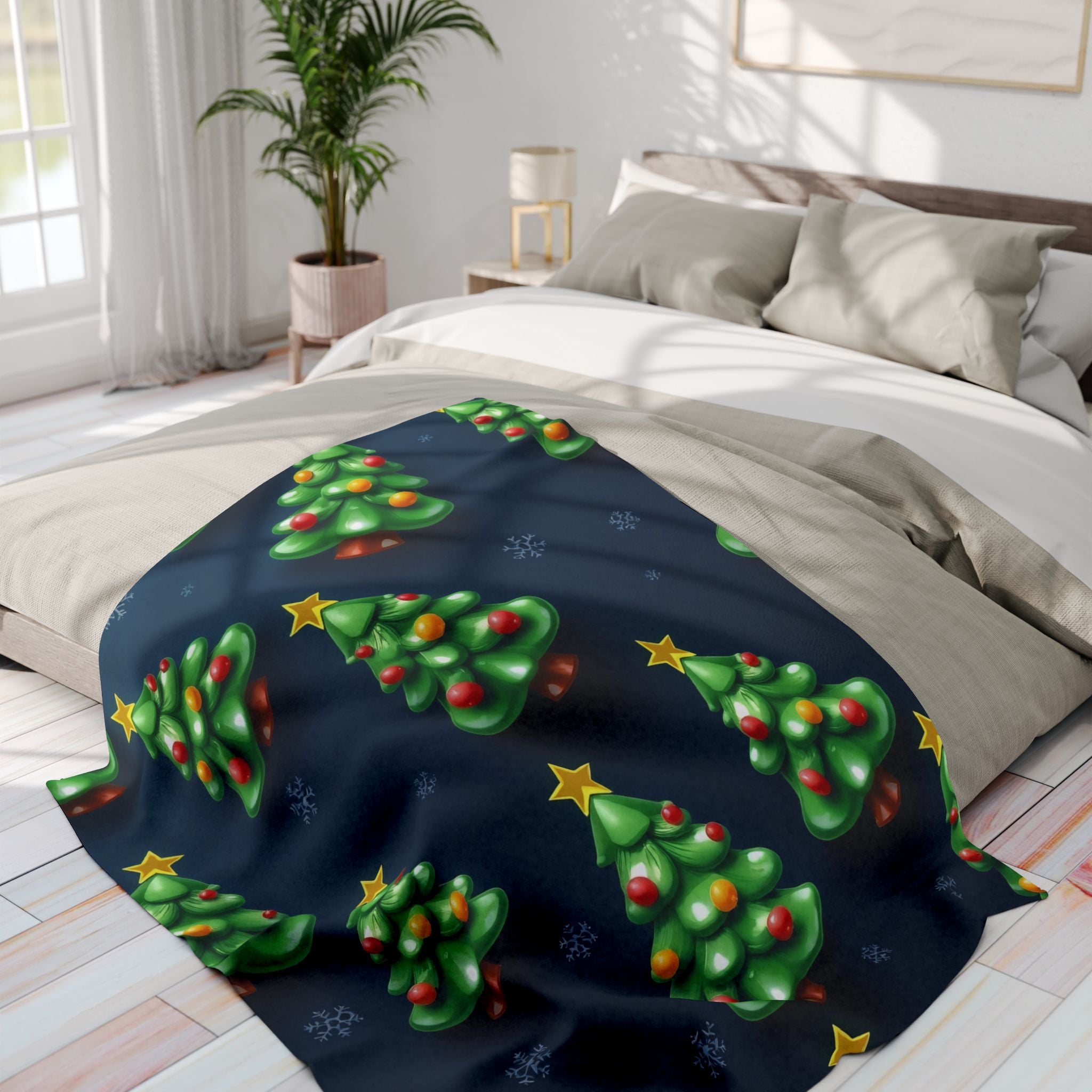 Bed with a festive blanket featuring Christmas tree designs in a bright bedroom.