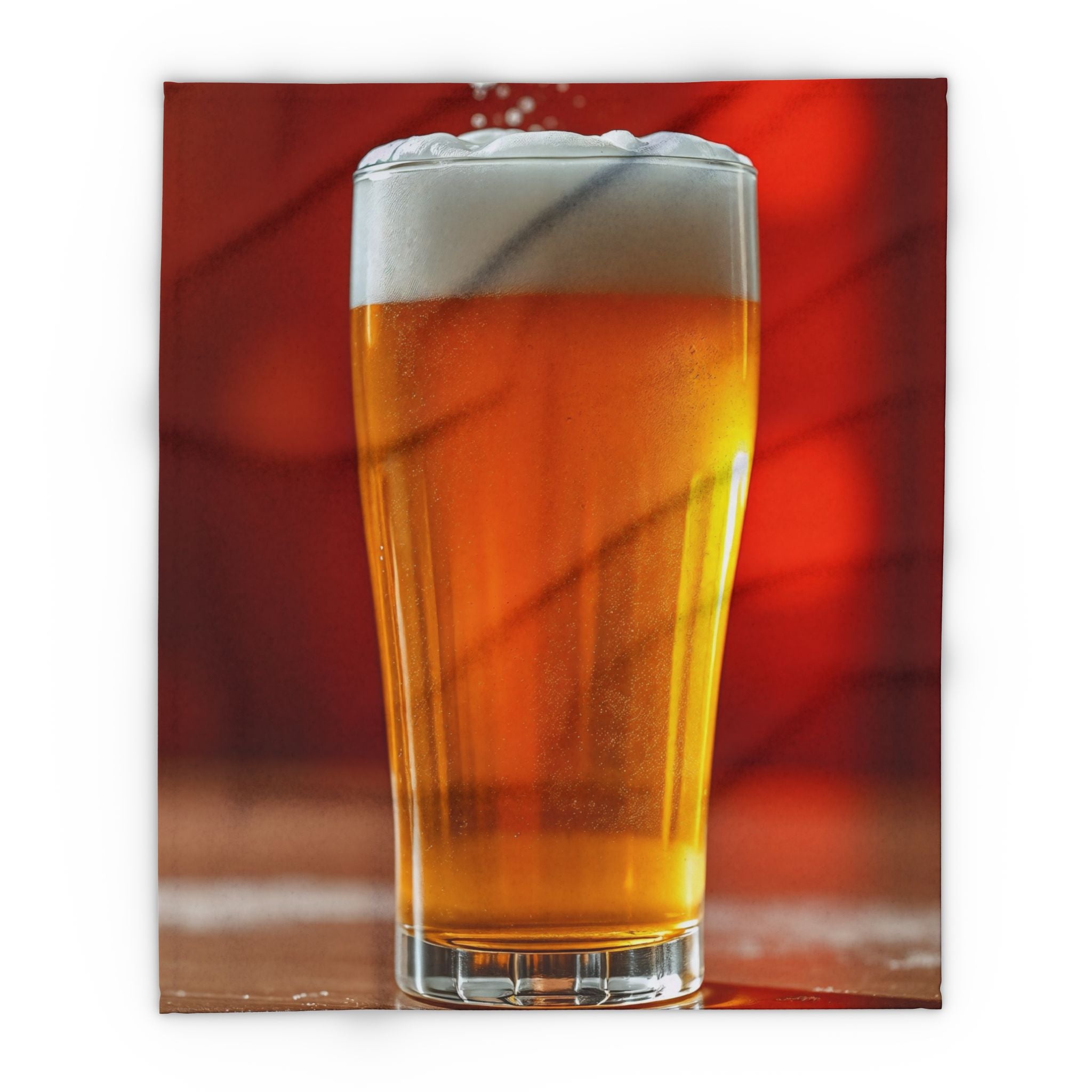 Printed fleece blanket of a glass of beer with a red blurred background.