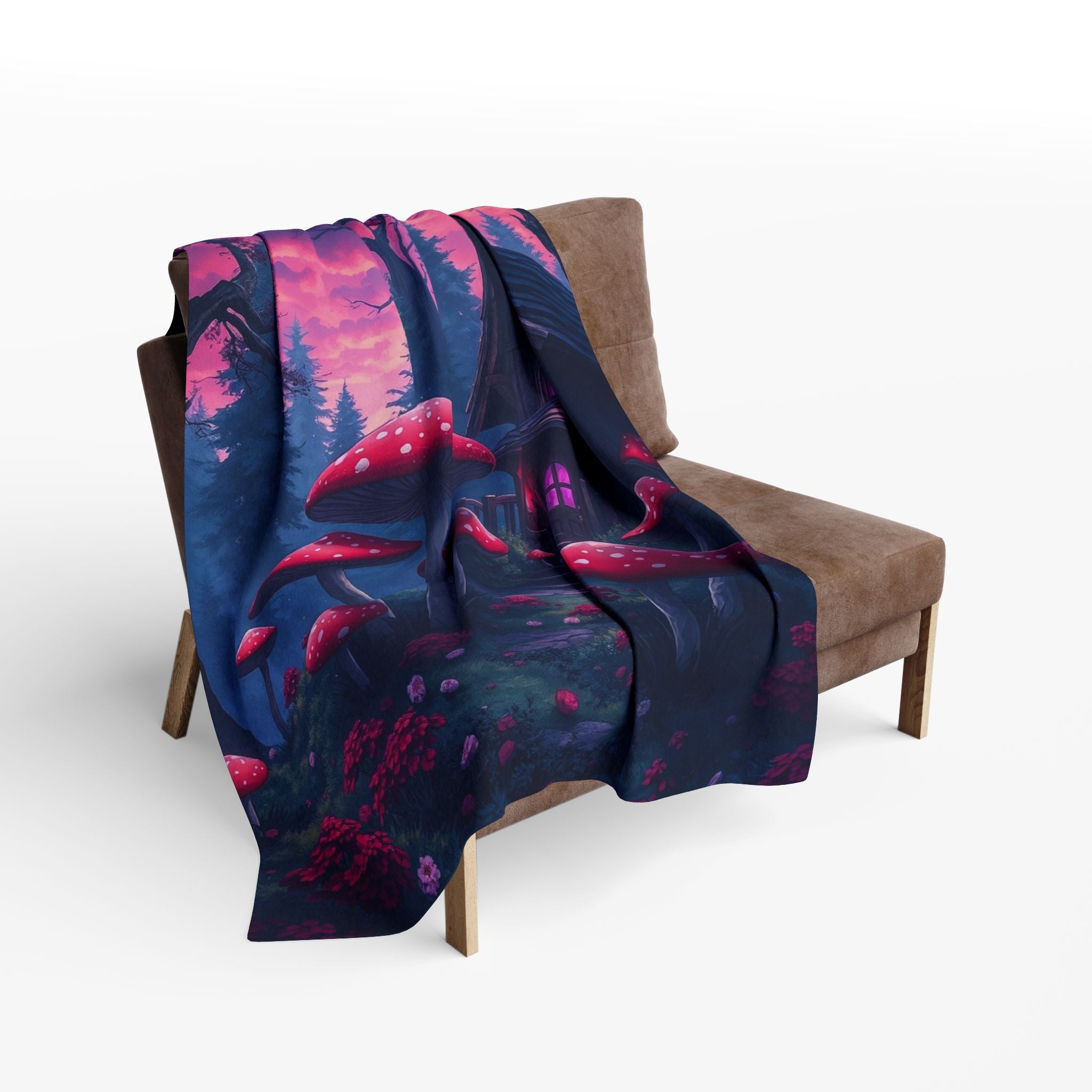 Futon chair with a colorful spooky Halloween haunted cottage in a forest with toad stools fleece blanket draped over it.