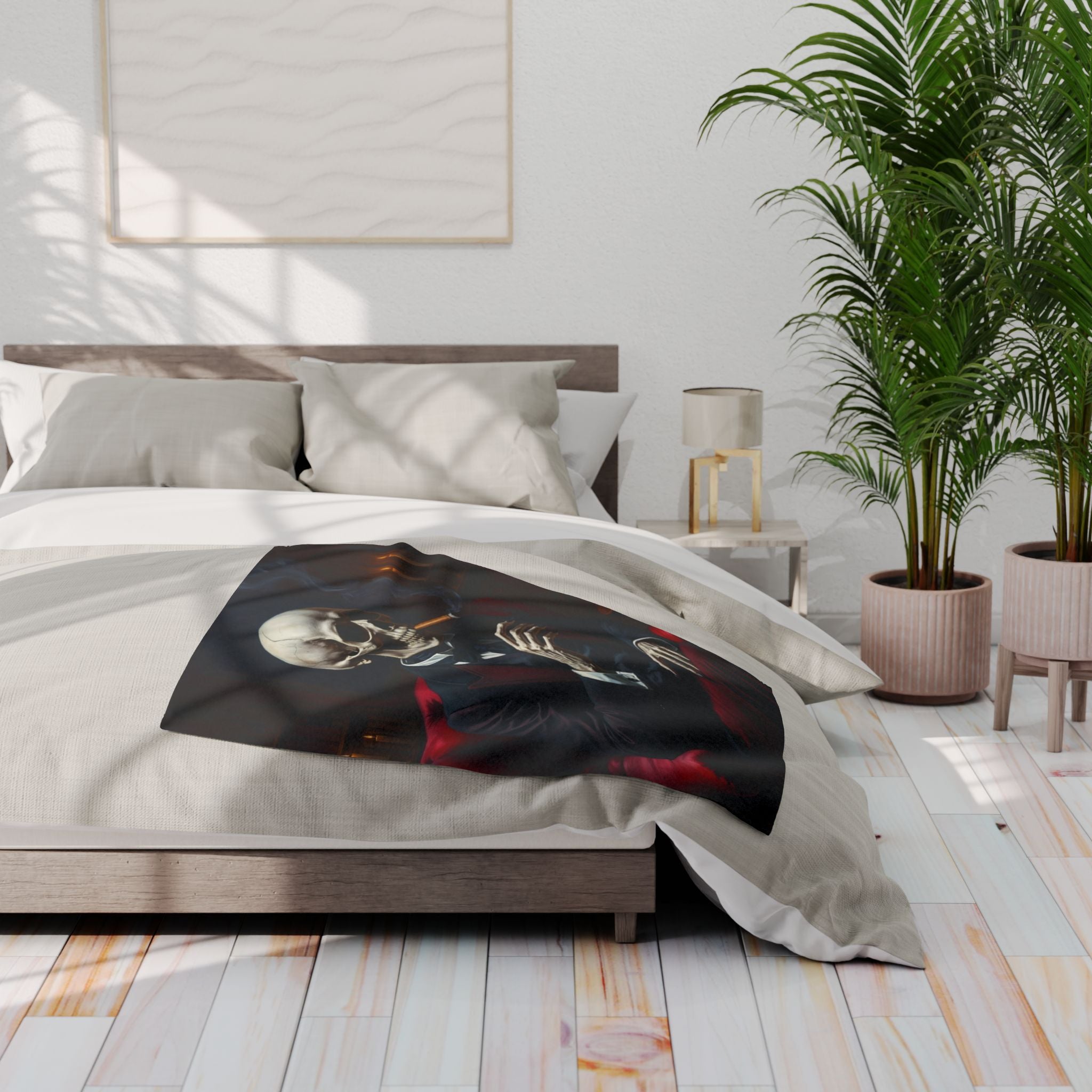 Bedroom with a bed featuring a black blanket with a skull design, a nightstand, and plants.