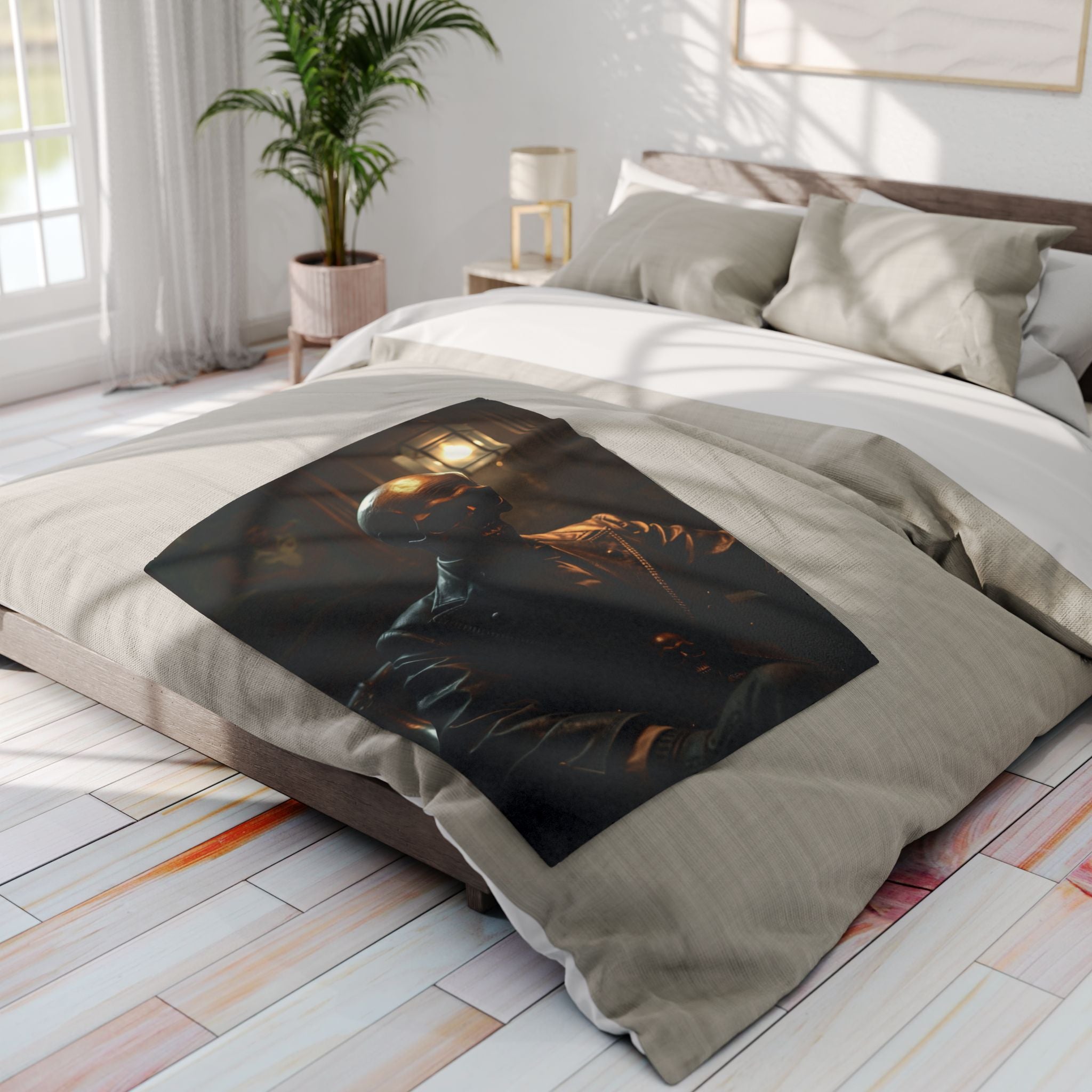 Decorative fleece blanket with a gothic skull design on a bed in a bright bedroom. 