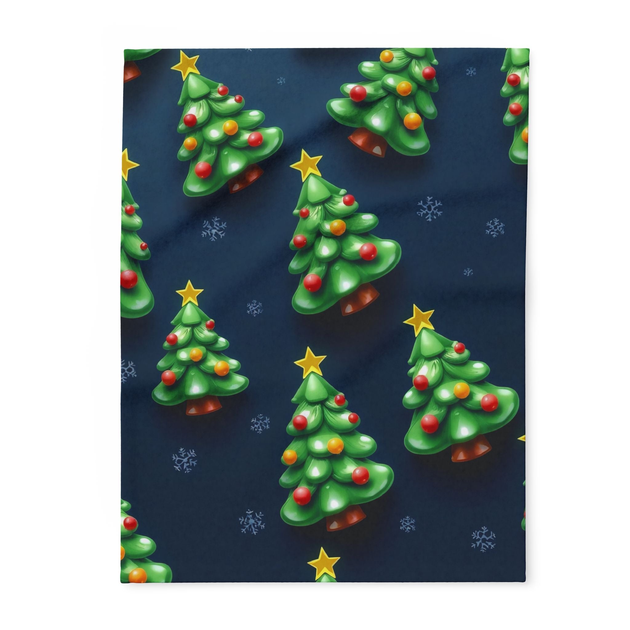 Blanket with pattern of Christmas trees with stars and decorations on a dark blue background.